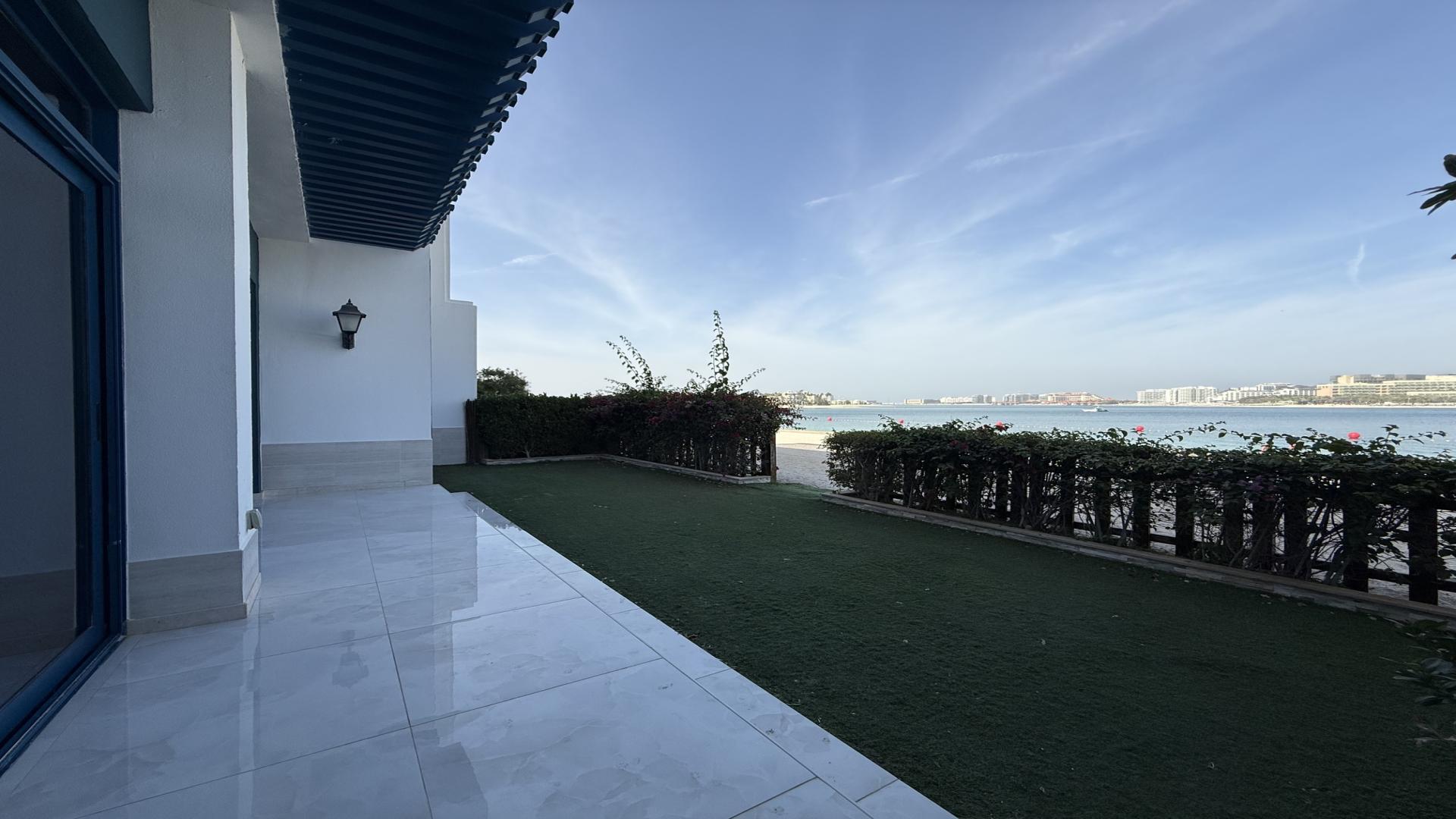 Luxurious villa interior with spacious living area and large windows in Palma Residences