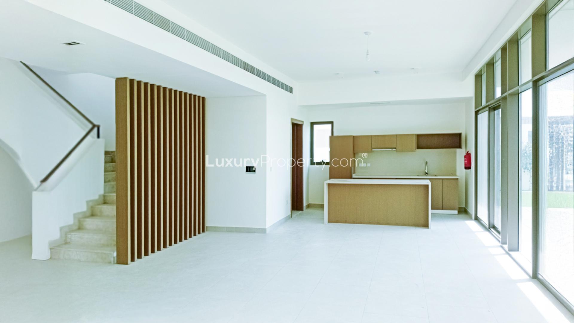 Modern villa exterior with landscaped yard in Tilal Al Furjan, Al Furjan West community