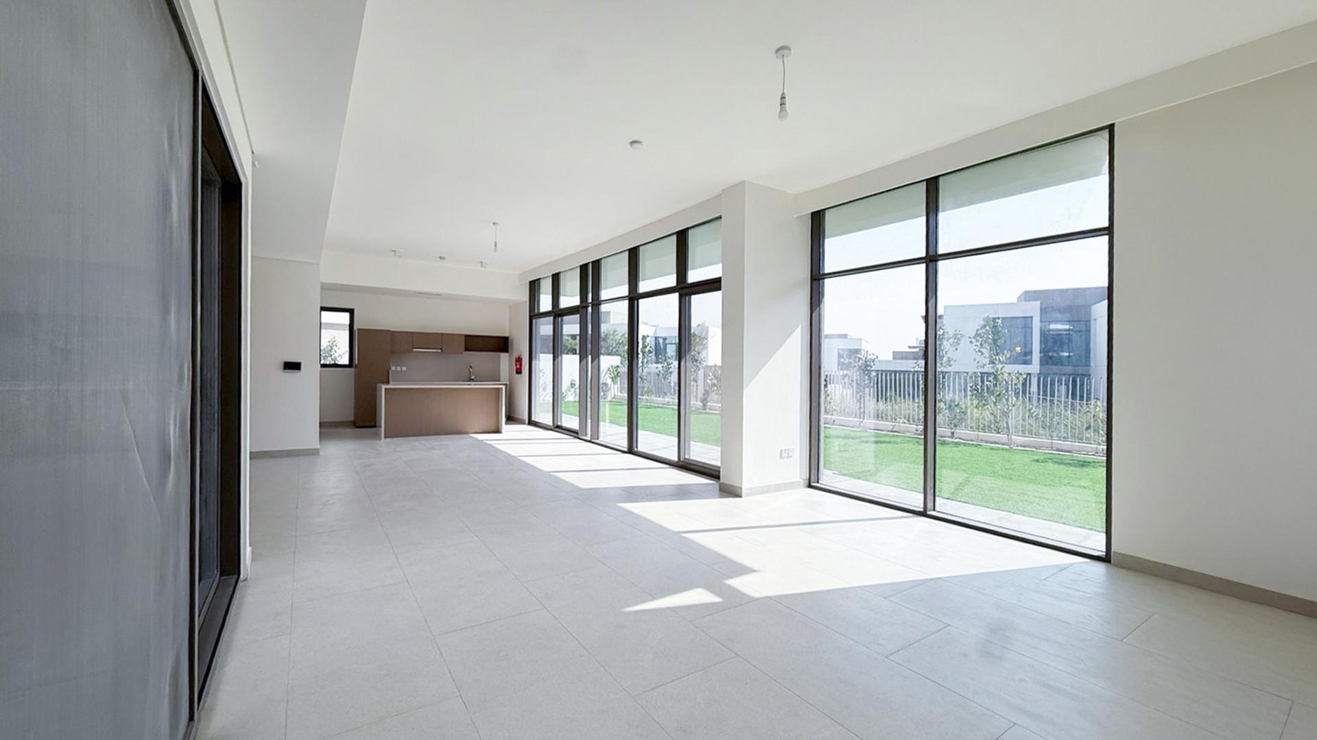 Modern kitchen with large windows in Tilal Al Furjan West villa for rent