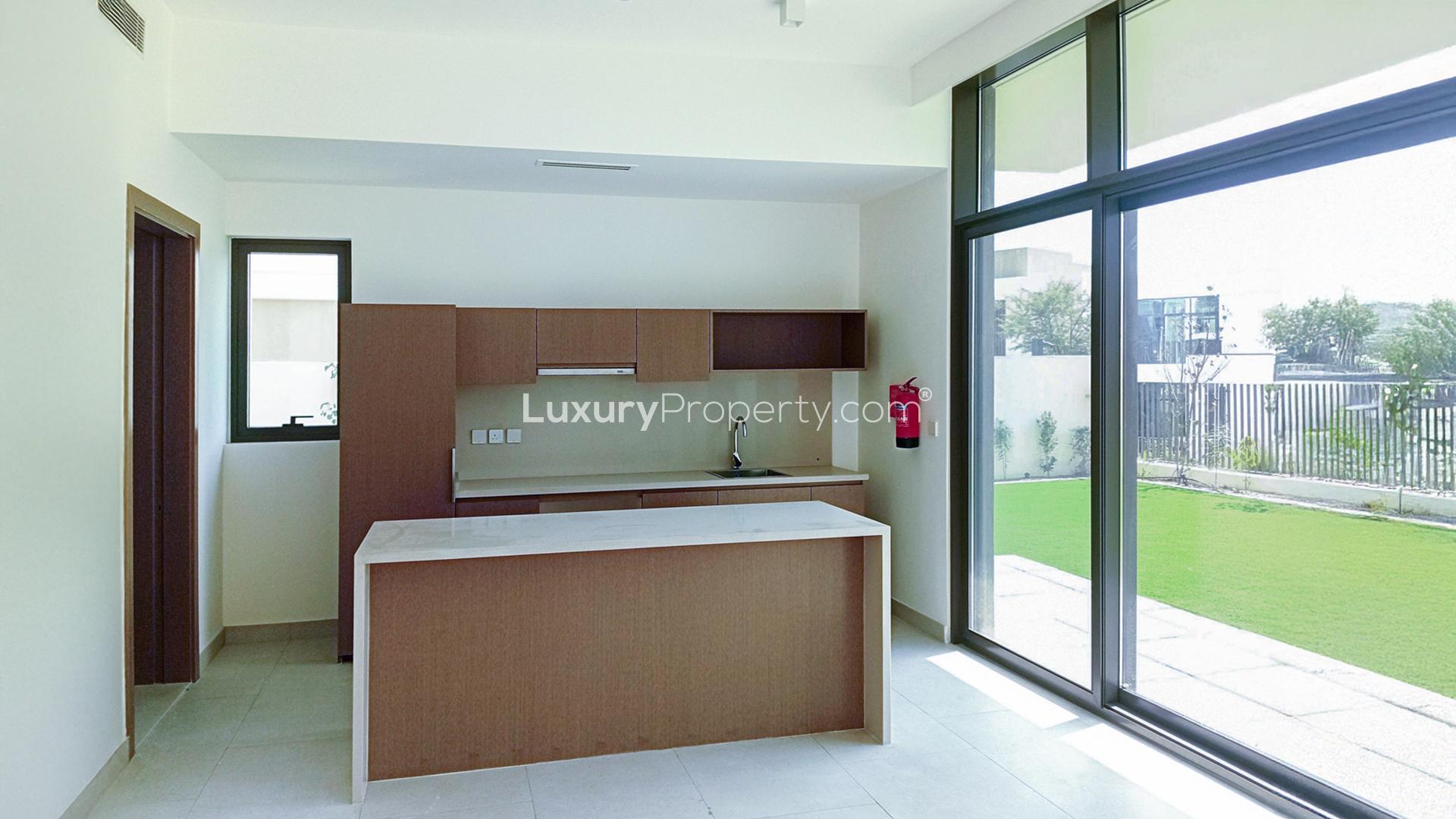 Spacious open-plan kitchen and living area in Tilal Al Furjan villa for rent