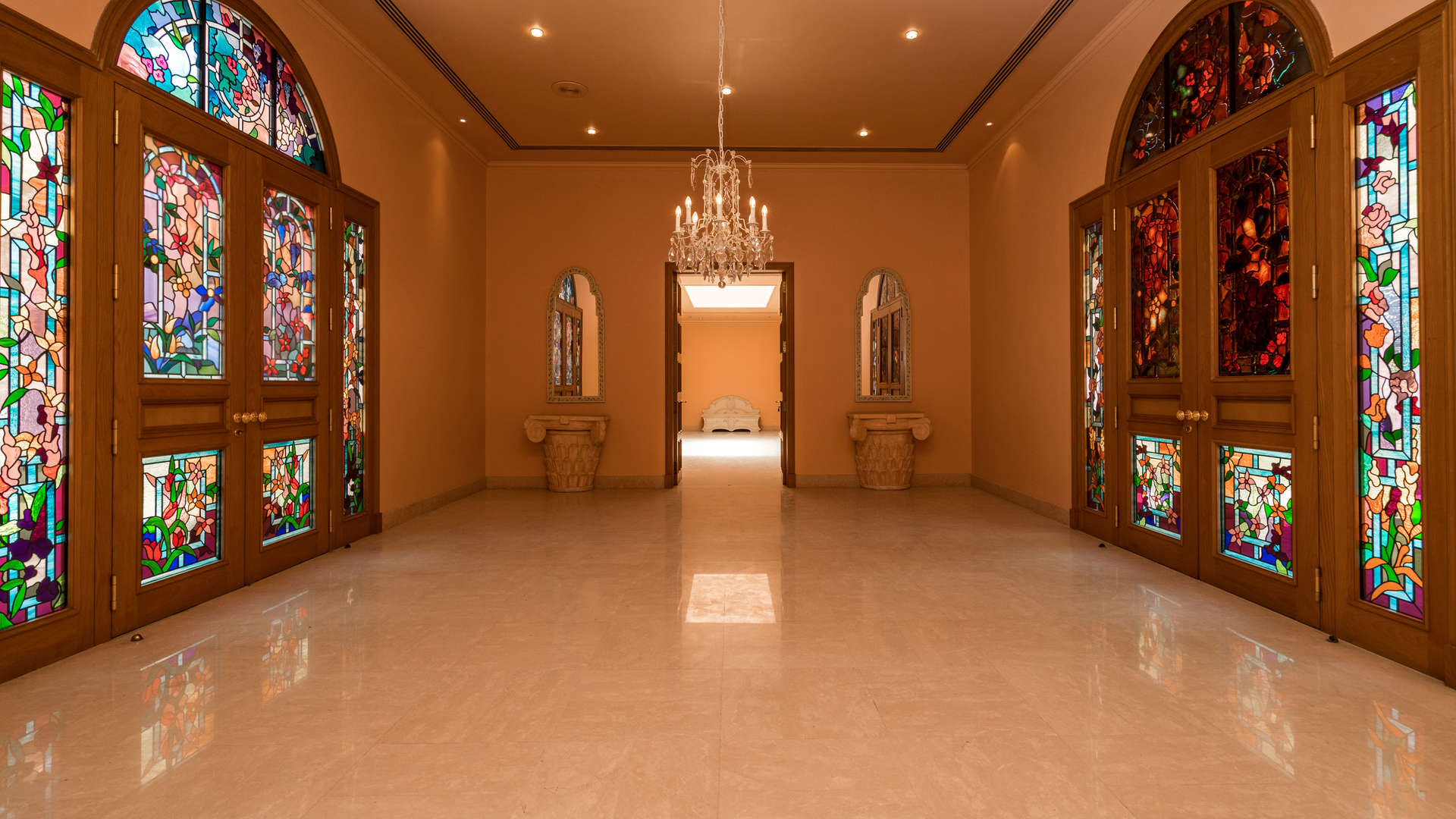 Spacious living area with large windows in Umm Suqeim mansion villa for rent