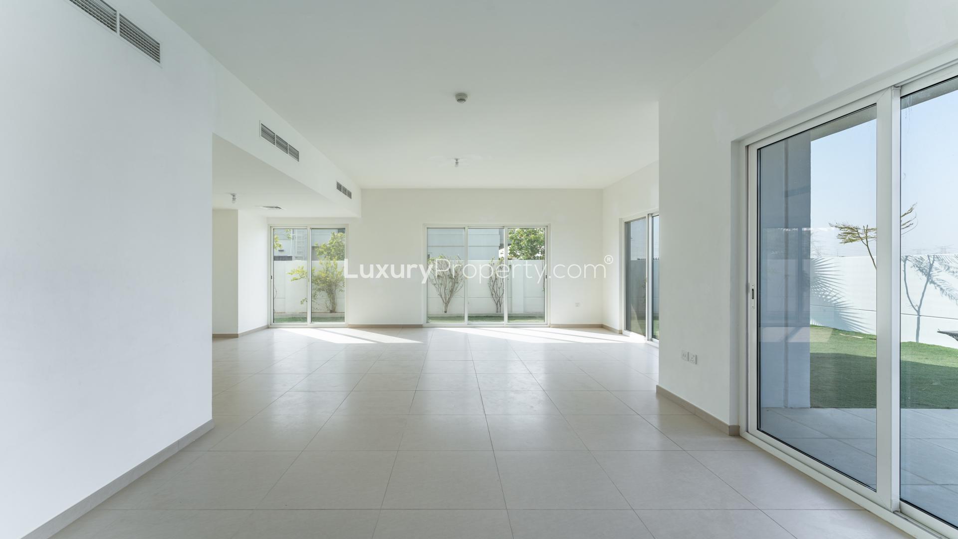 Bright backyard and patio of 5-bed townhouse in Arabella, Mudon for rent