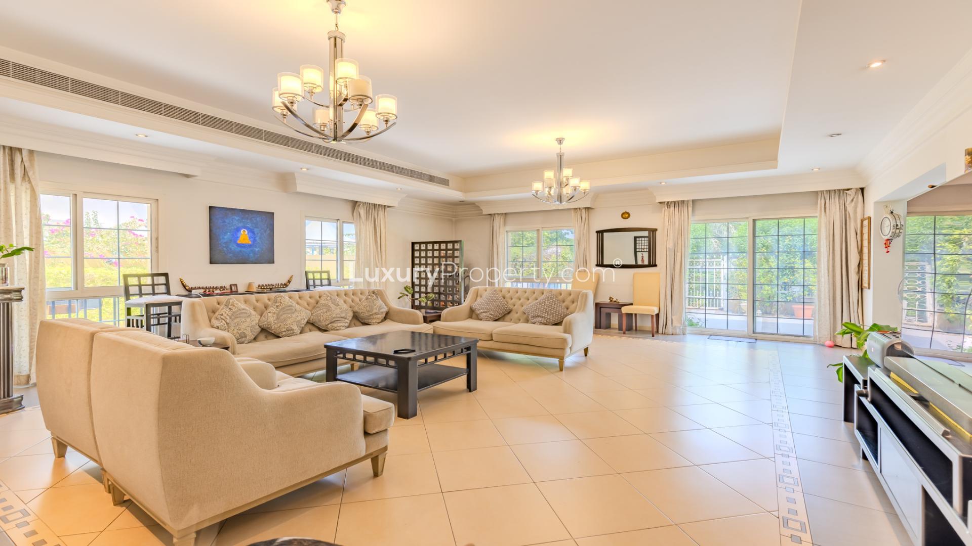 Upgraded 5-bedroom villa exterior with driveway in The Aldea, The Villa community