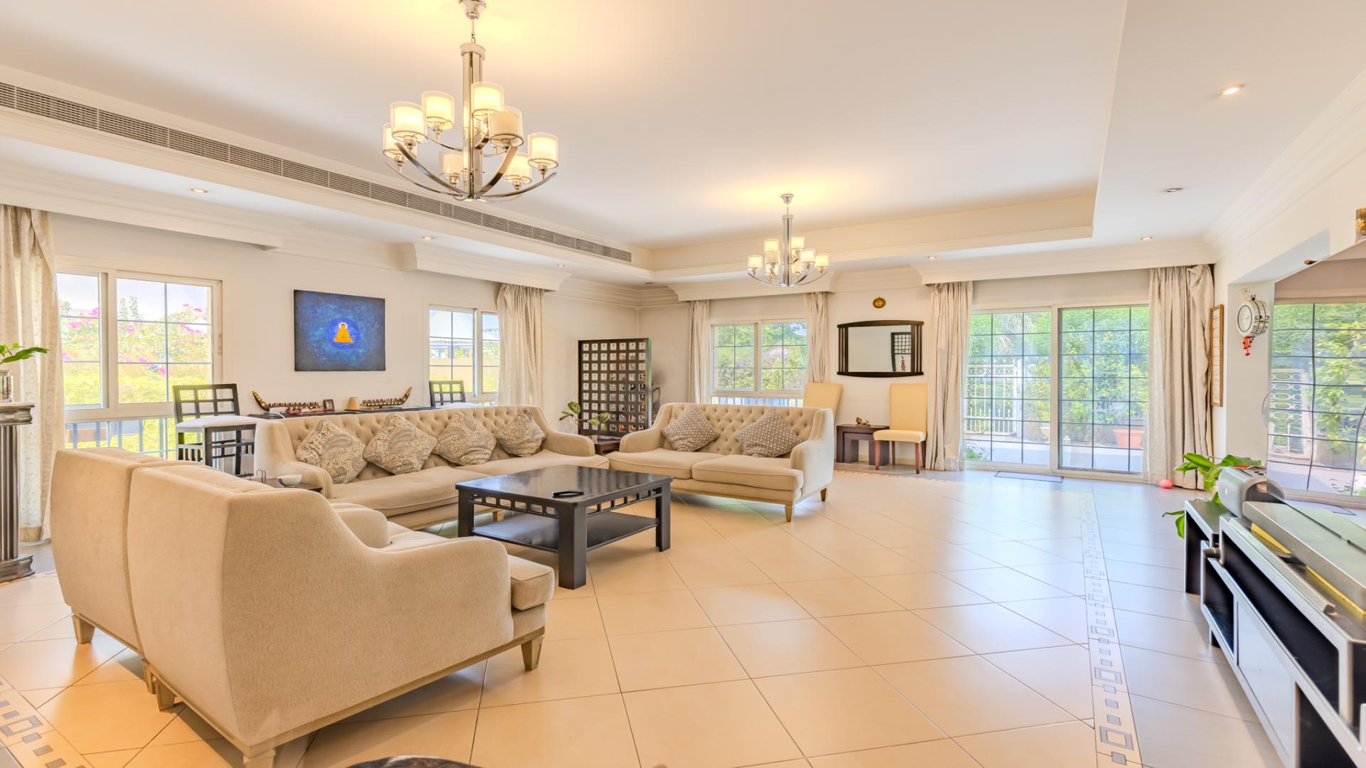 Upgraded 5-bedroom villa exterior with driveway in The Aldea, The Villa community