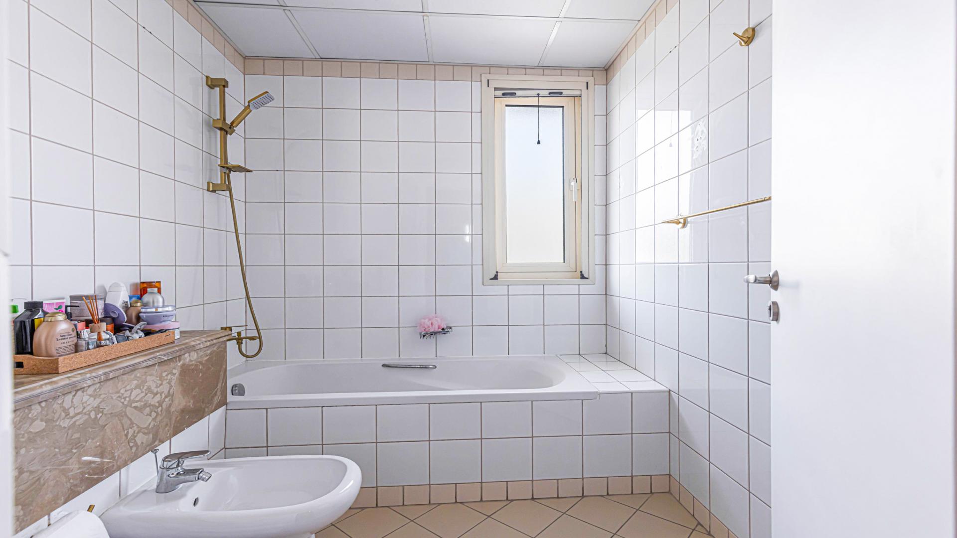 Modern living room in upgraded Saheel villa, Arabian Ranches, with elegant decor and bright lighting