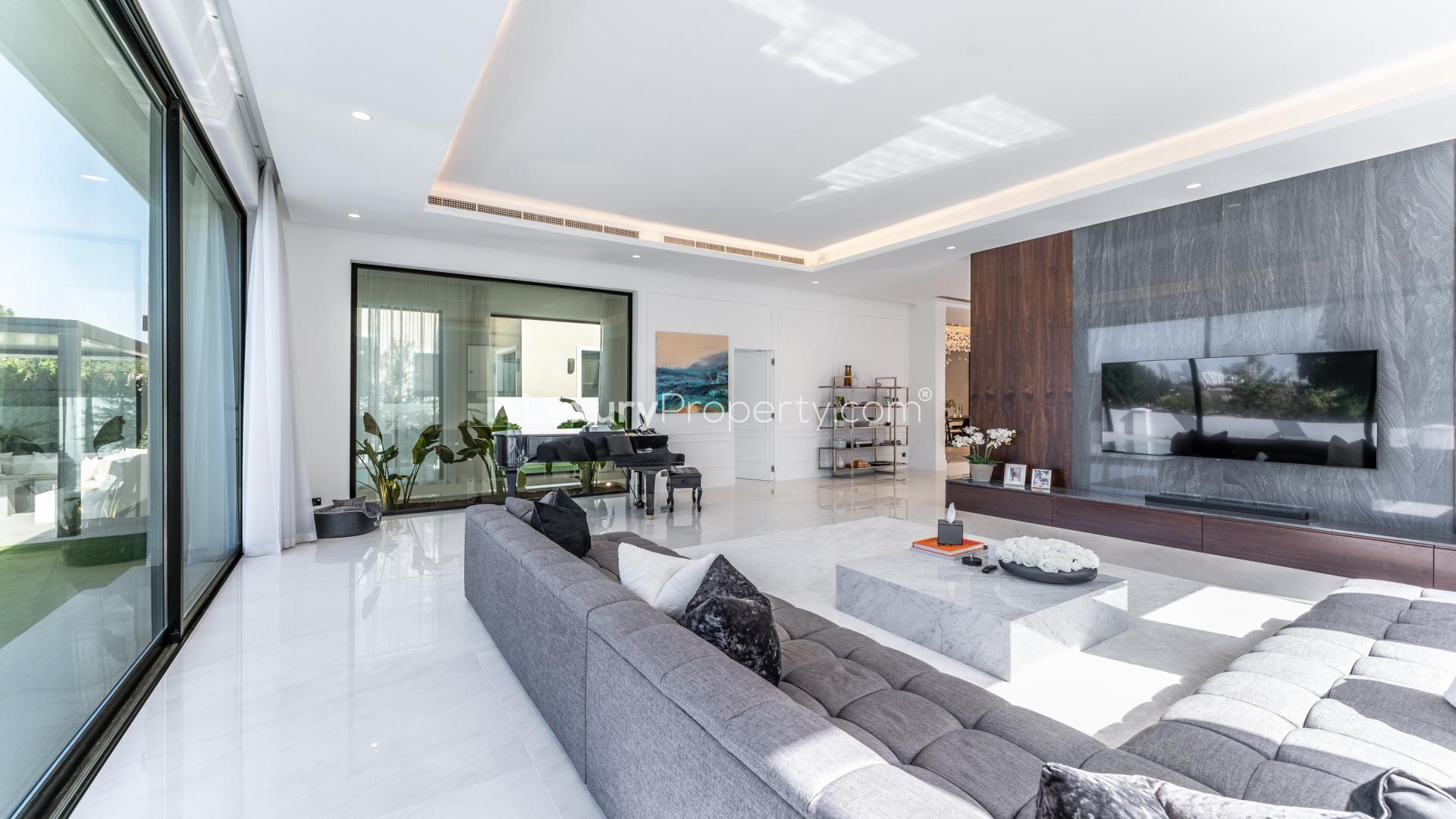 Modern dining area and kitchen in fully upgraded villa, Jumeirah Golf Estates, Earth community
