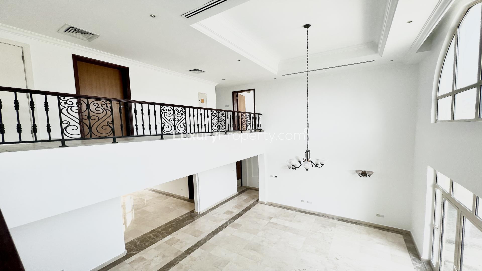 "Spacious Jumeirah Islands villa interior with elegant staircase and large windows, LP40216 rental.",Luxurious Jumeirah Islands villa interior with elegant balcony and chandelier, Mediterranean Clusters