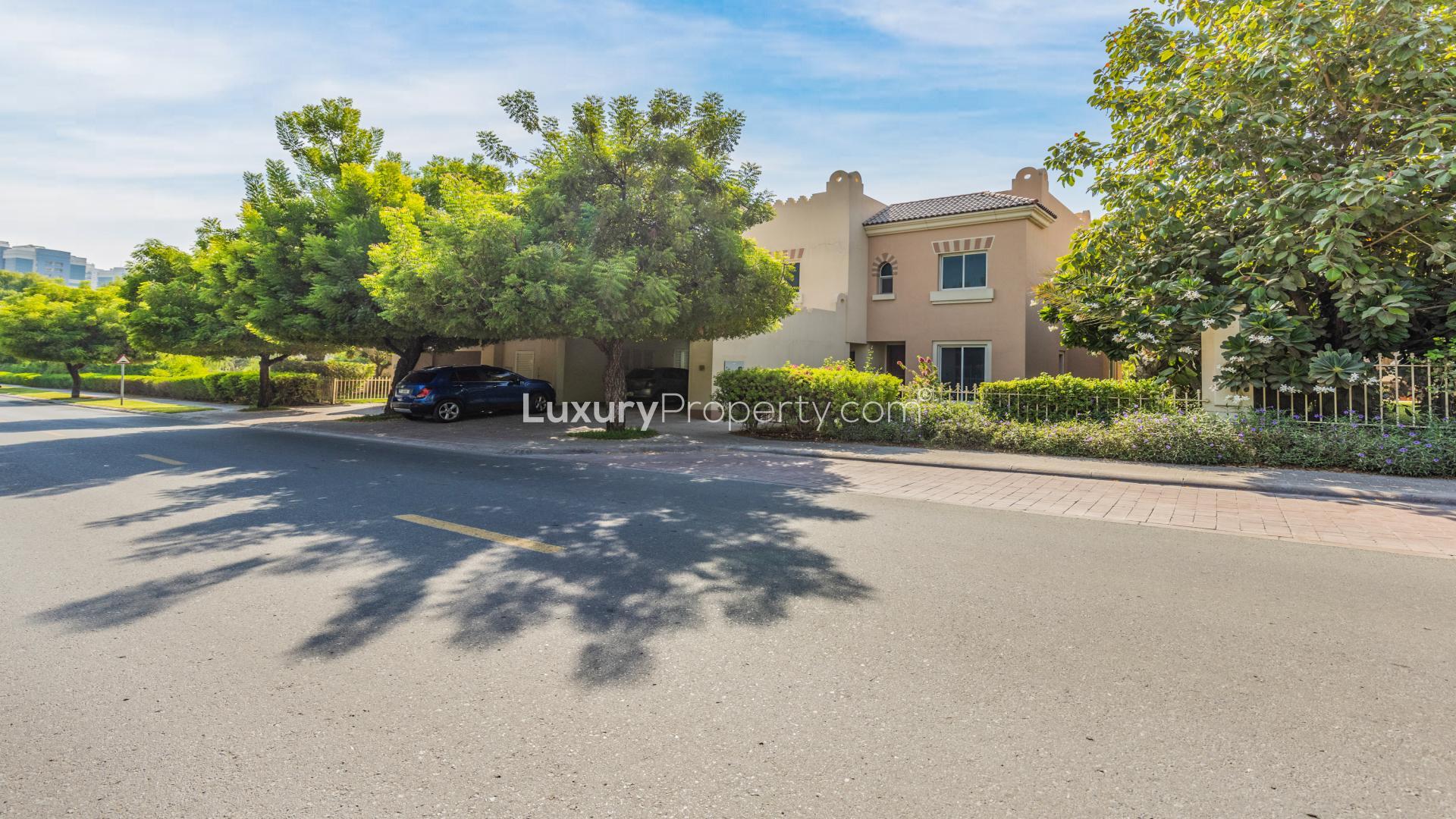 Spacious living area with kitchen view in 5-bedroom villa, Victory Heights, Dubai Sports City