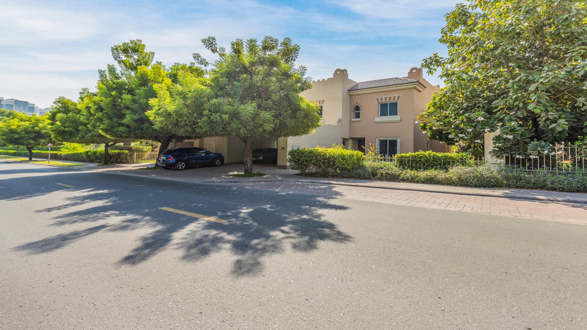 Spacious living area with kitchen view in 5-bedroom villa, Victory Heights, Dubai Sports City