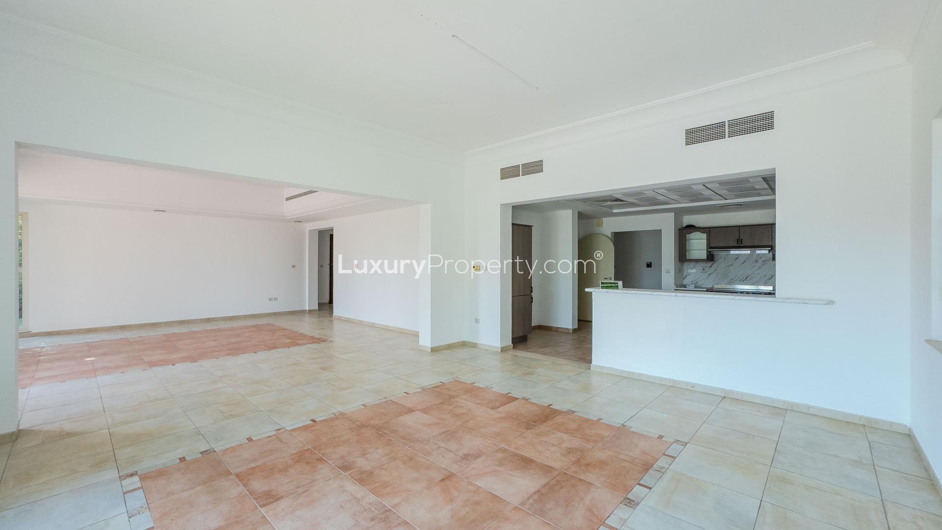 Spacious villa interior with large windows and golf course view in Victory Heights, Dubai