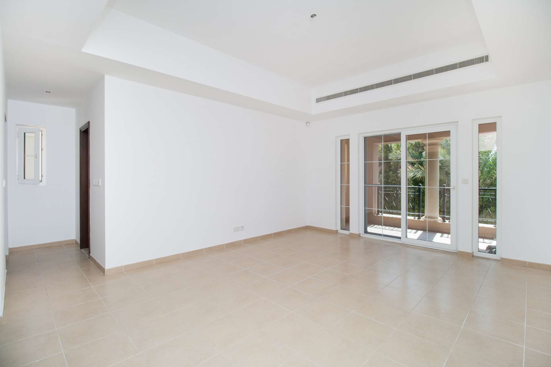 Spacious living room with large windows in Alvorada villa, Arabian Ranches, for rent