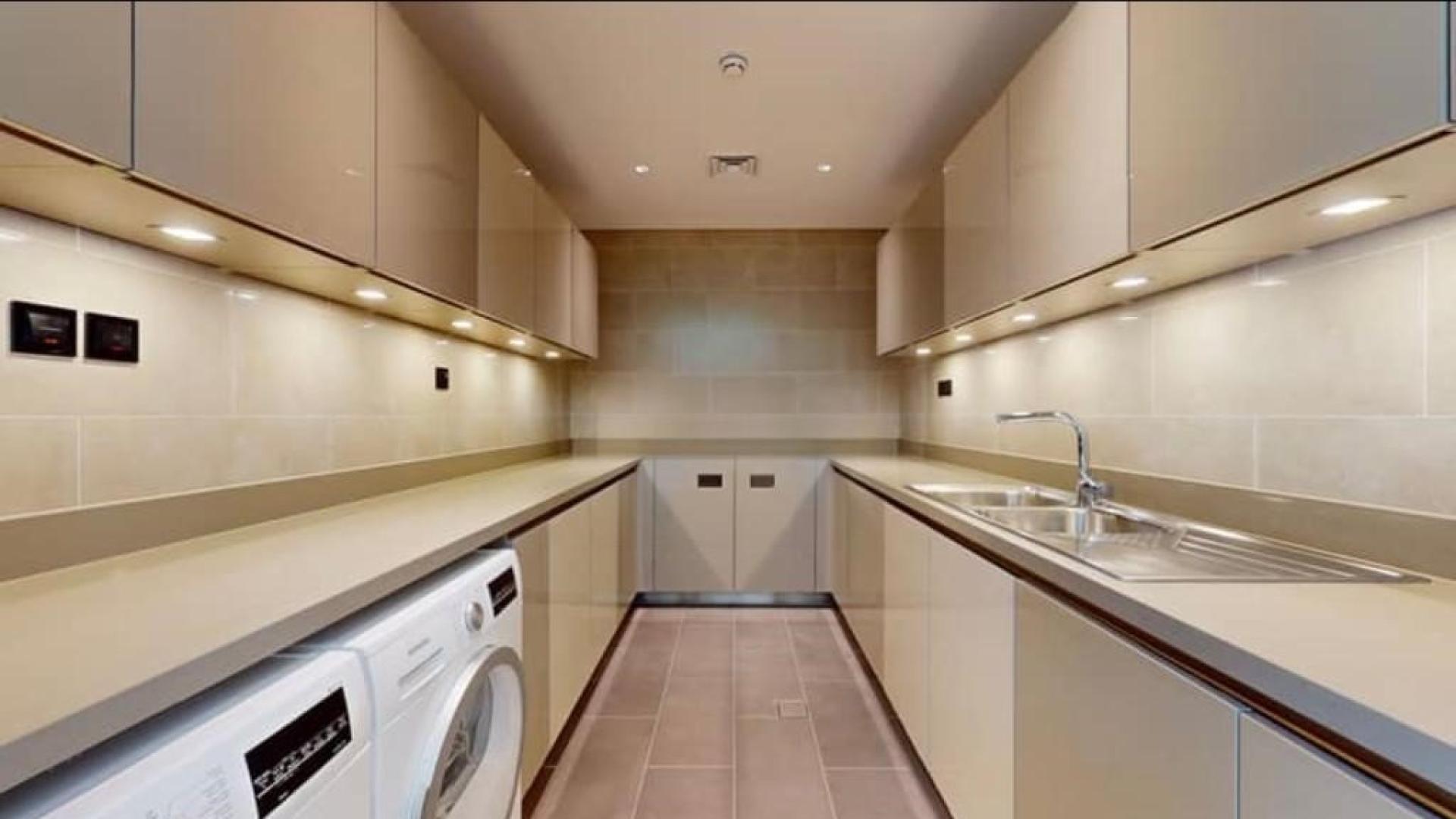 Modern kitchen with sleek cabinetry in Sobha Hartland Villas, Mohammed Bin Rashid City