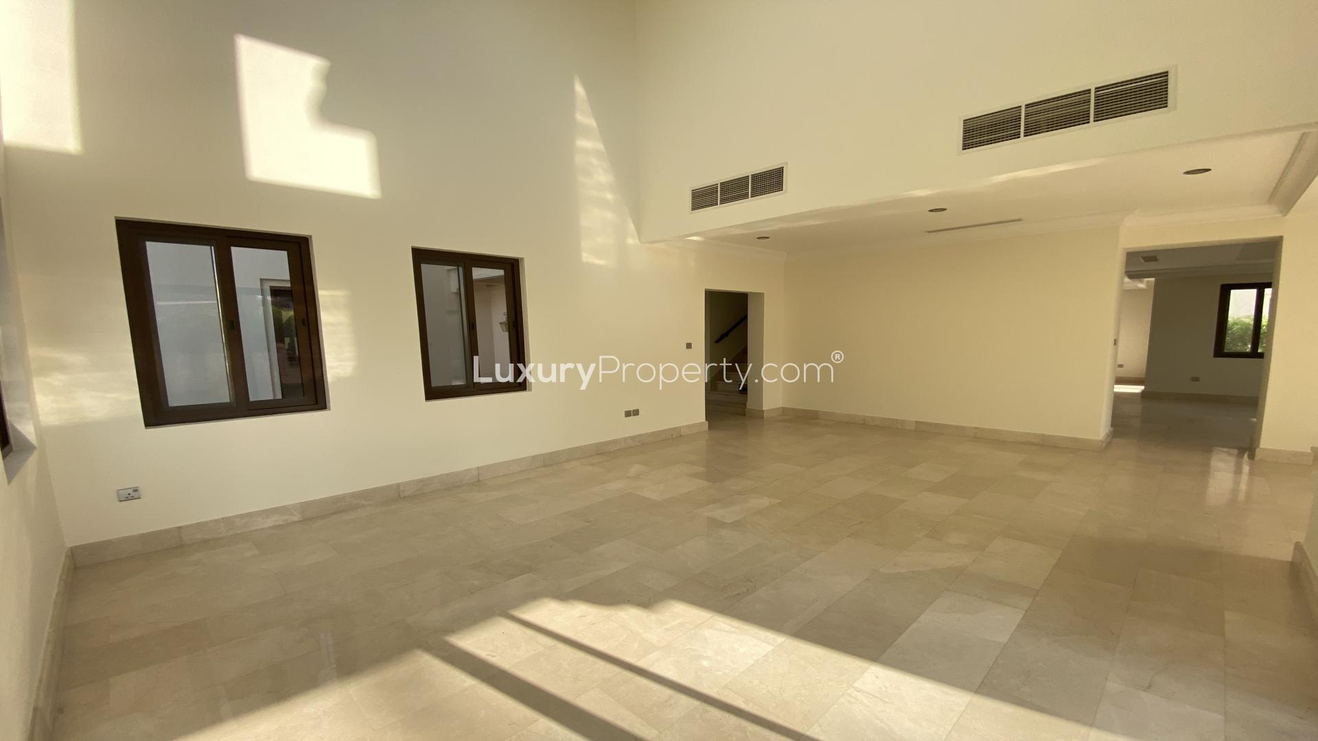Spacious living room with large windows in modern 6-bedroom villa, Arabian Ranches, Aseel