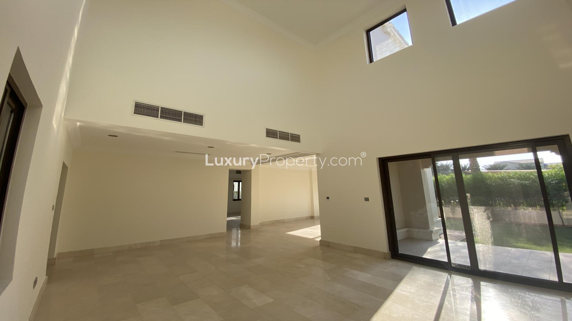 Modern 6-bedroom villa exterior in Aseel, Arabian Ranches, with private garden pathway