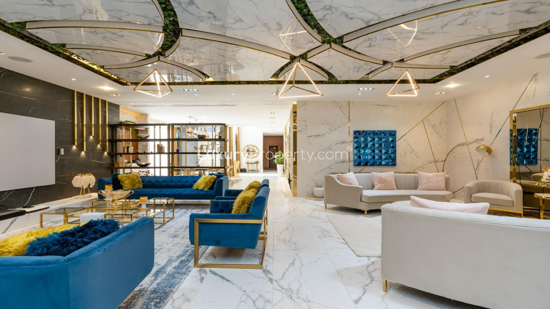 Luxurious living room in Whitefield villa, Damac Hills, featuring elegant decor and modern furnishings