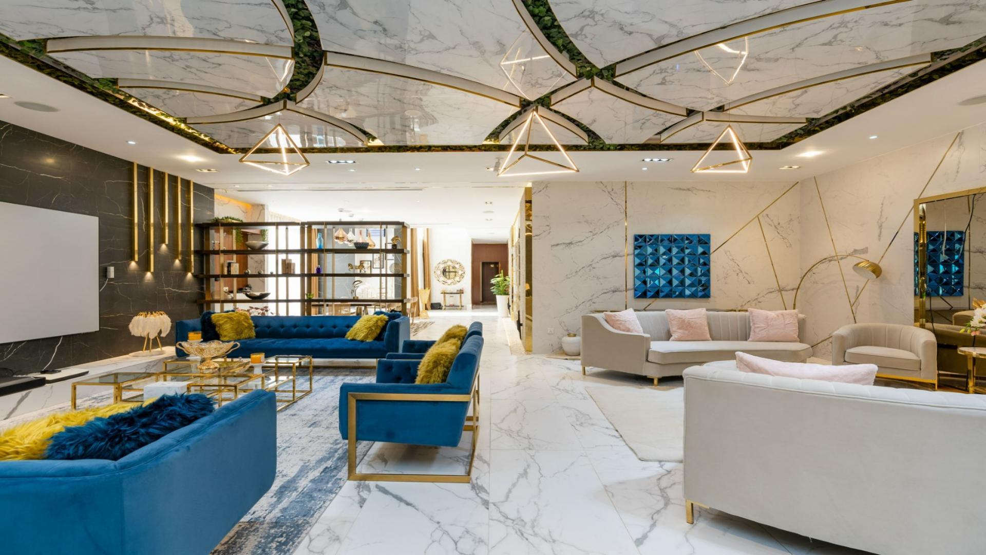 Luxurious living room in Whitefield villa, Damac Hills, featuring elegant decor and modern furnishings