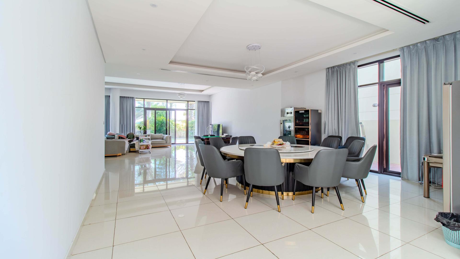 Luxurious dining area in a furnished villa with garden view, Damac Hills, Whitefield