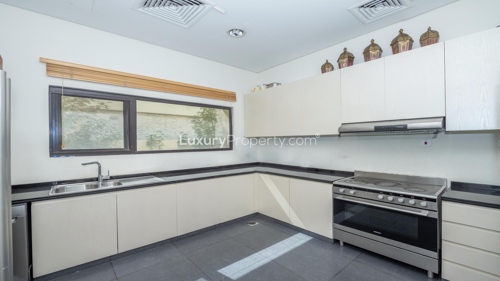 Modern kitchen in fully furnished 5-bedroom villa, Brookfield, DAMAC Hills, available for rent