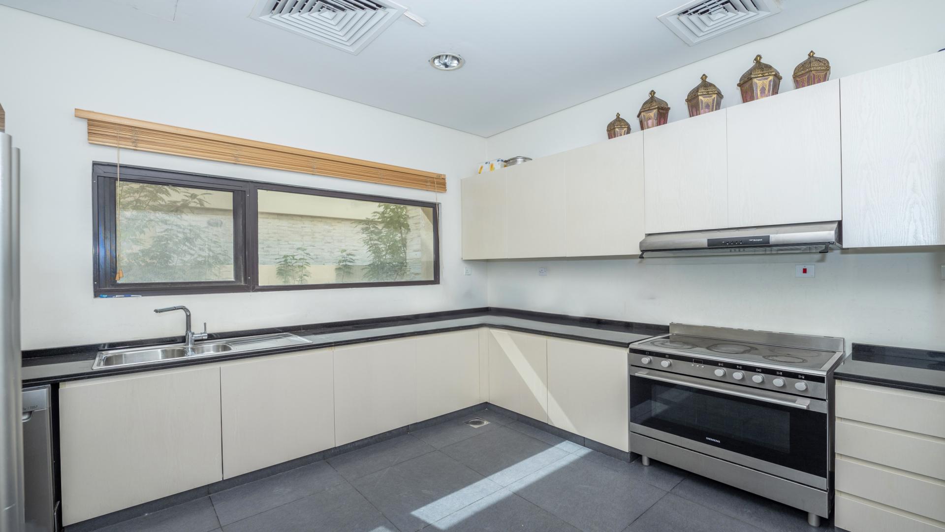 Modern kitchen in fully furnished 5-bedroom villa, Brookfield, DAMAC Hills, available for rent