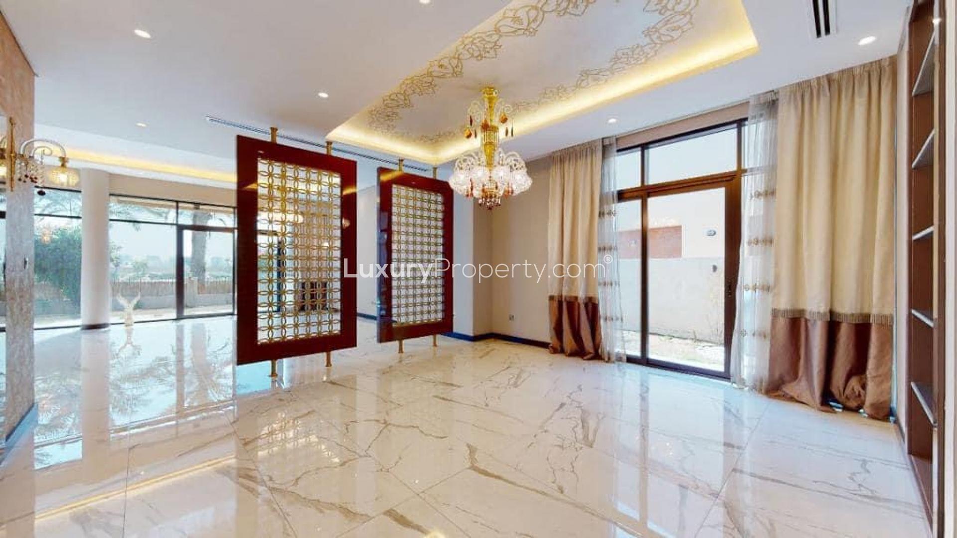 Luxurious villa interior with chandelier and marble flooring in Damac Hills, Brookfield