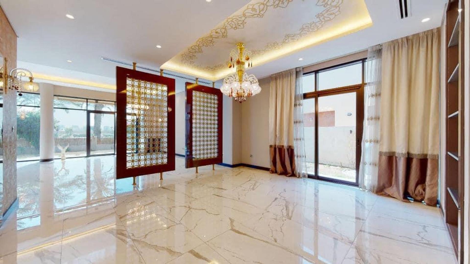 Luxurious villa interior with chandelier and marble flooring in Damac Hills, Brookfield