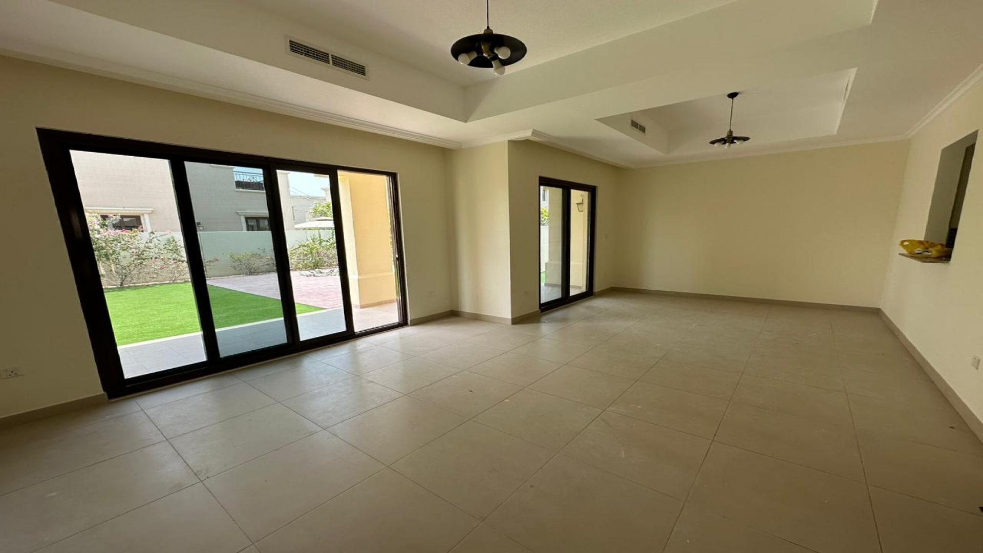 Spacious 5-bedroom Lila Villa exterior with lush lawn in Arabian Ranches 2 for rent
