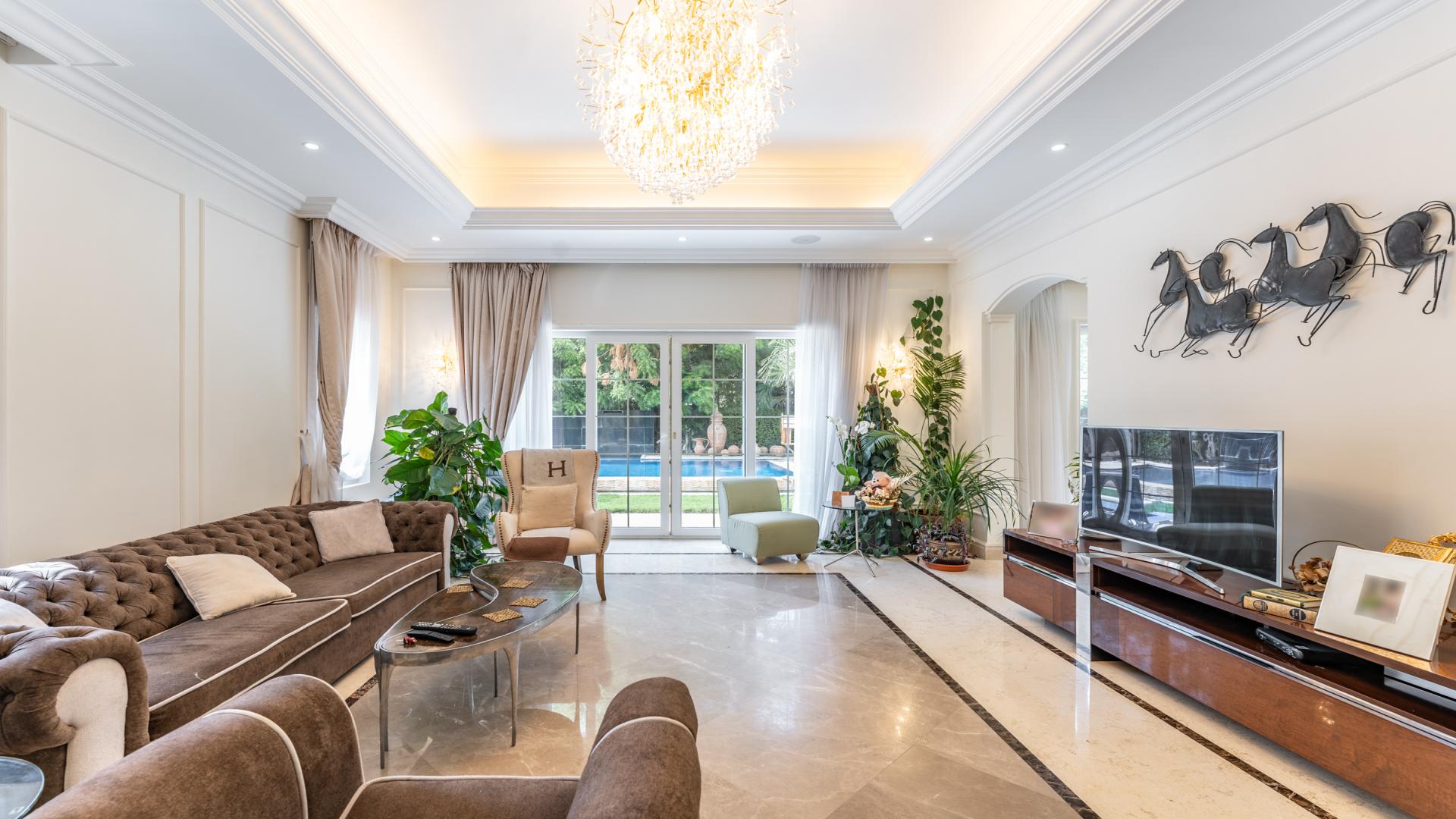 Luxurious living room in 5-bedroom villa, Polo Homes, Arabian Ranches, with elegant decor