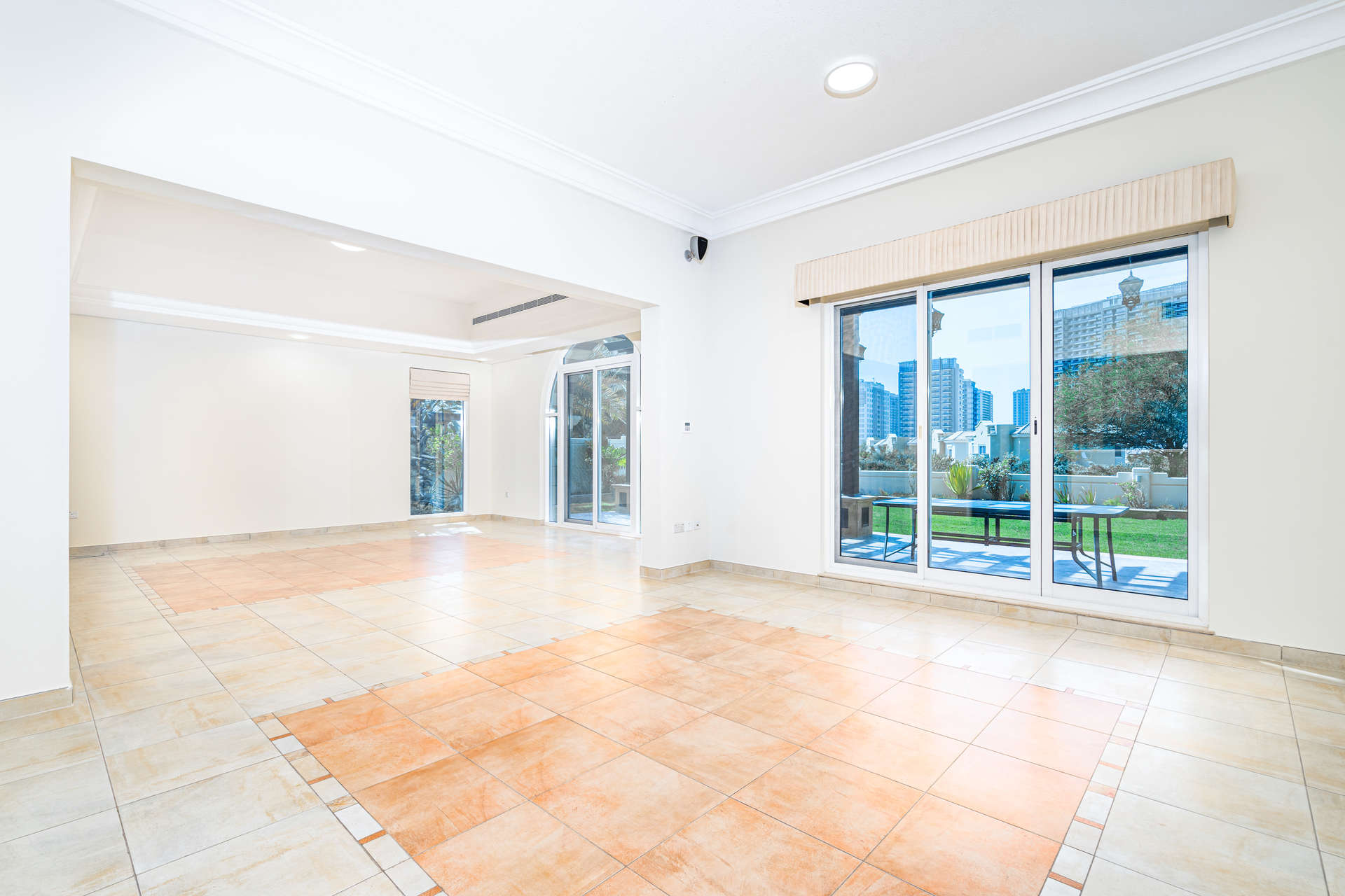 Spacious living room in villa with large windows and golf course views in Calida Village