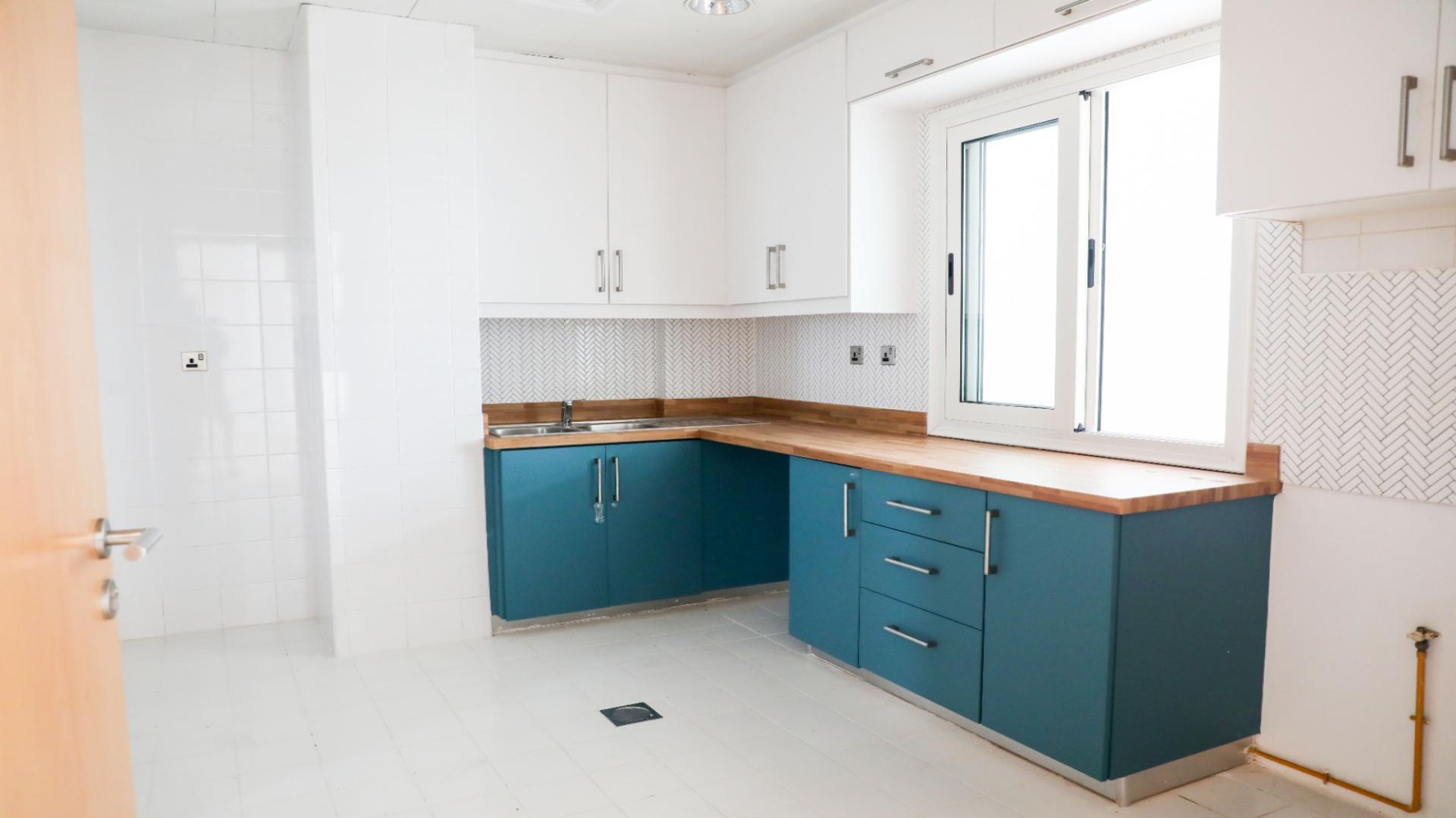 Modern kitchen in luxury 5-bed villa, Palma Residences, Palm Jumeirah, featuring stylish cabinetry