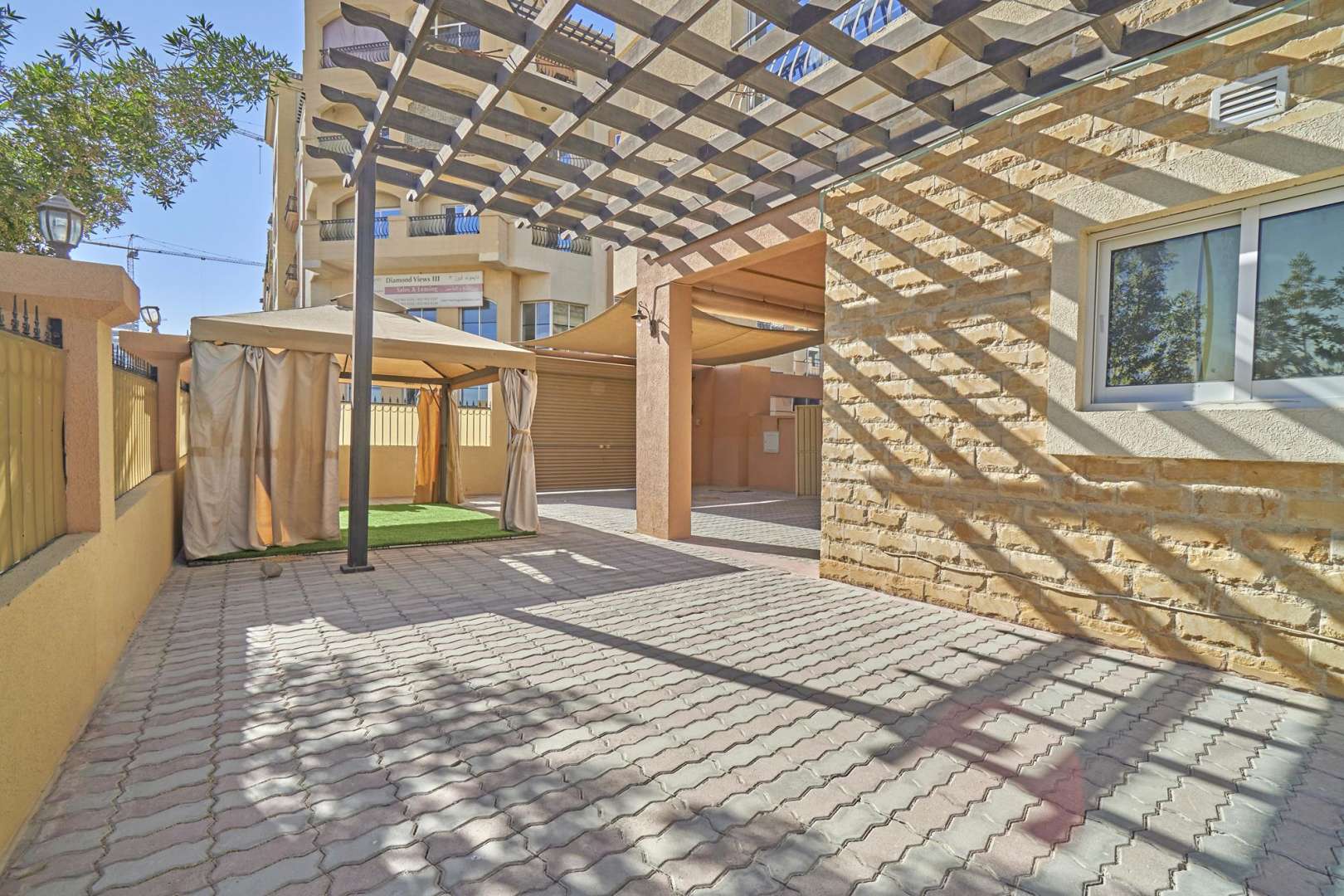 Empty room with wooden flooring in Diamond Views townhouse, Jumeirah Village Circle