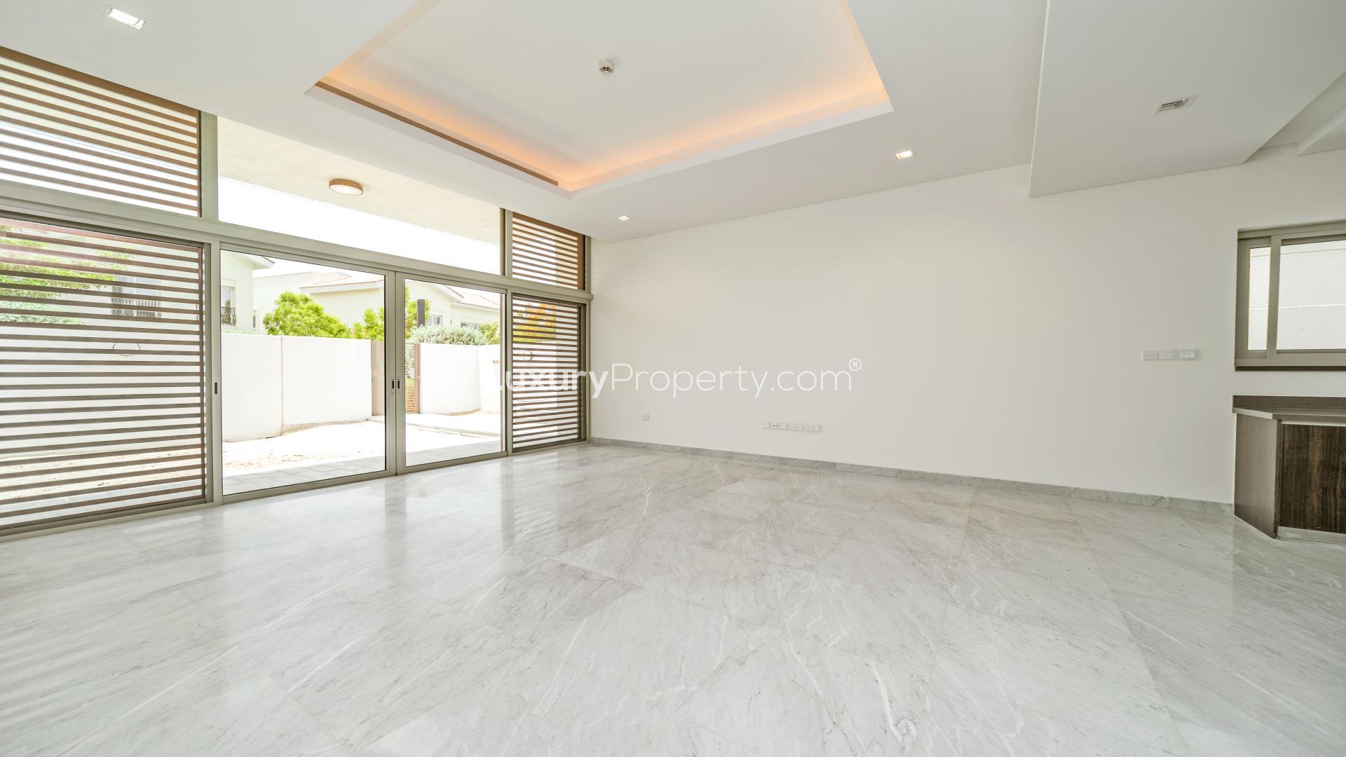 Contemporary villa interior with marble flooring and large windows in District One, Dubai