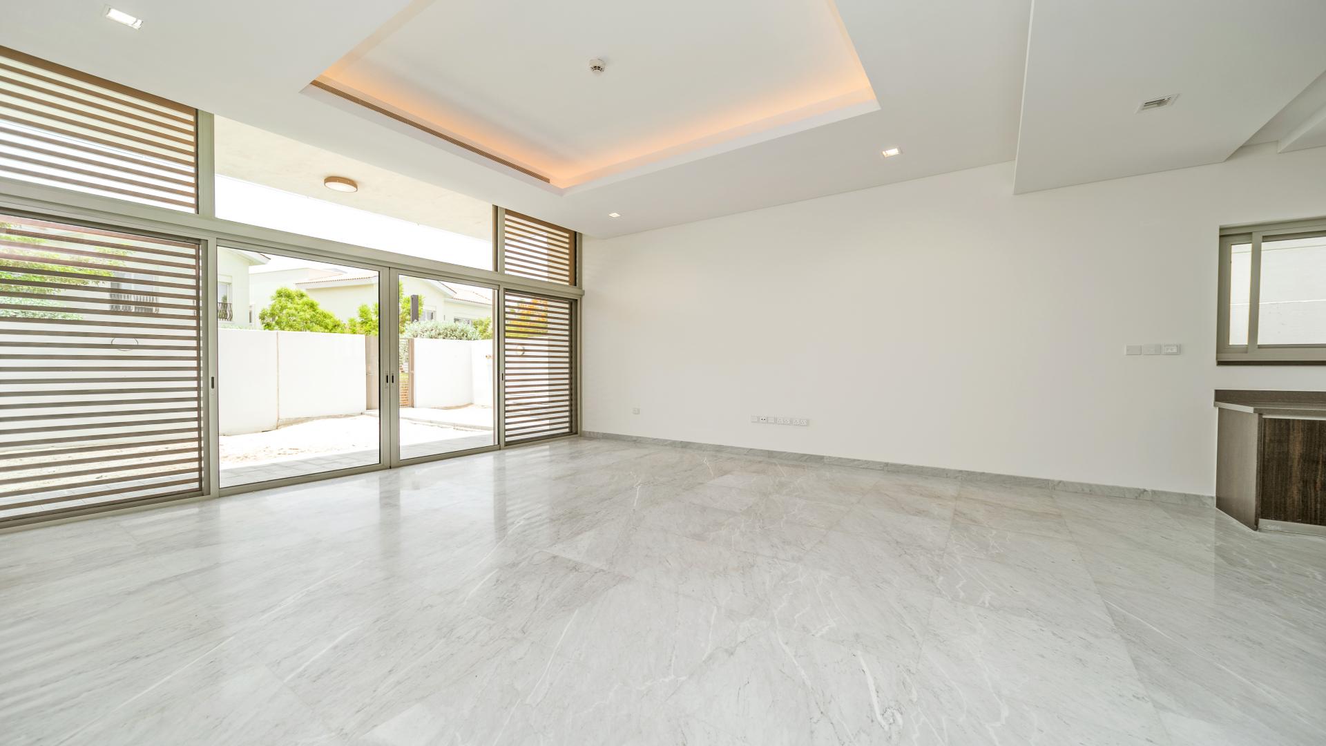 Contemporary villa interior with marble flooring and large windows in District One, Dubai