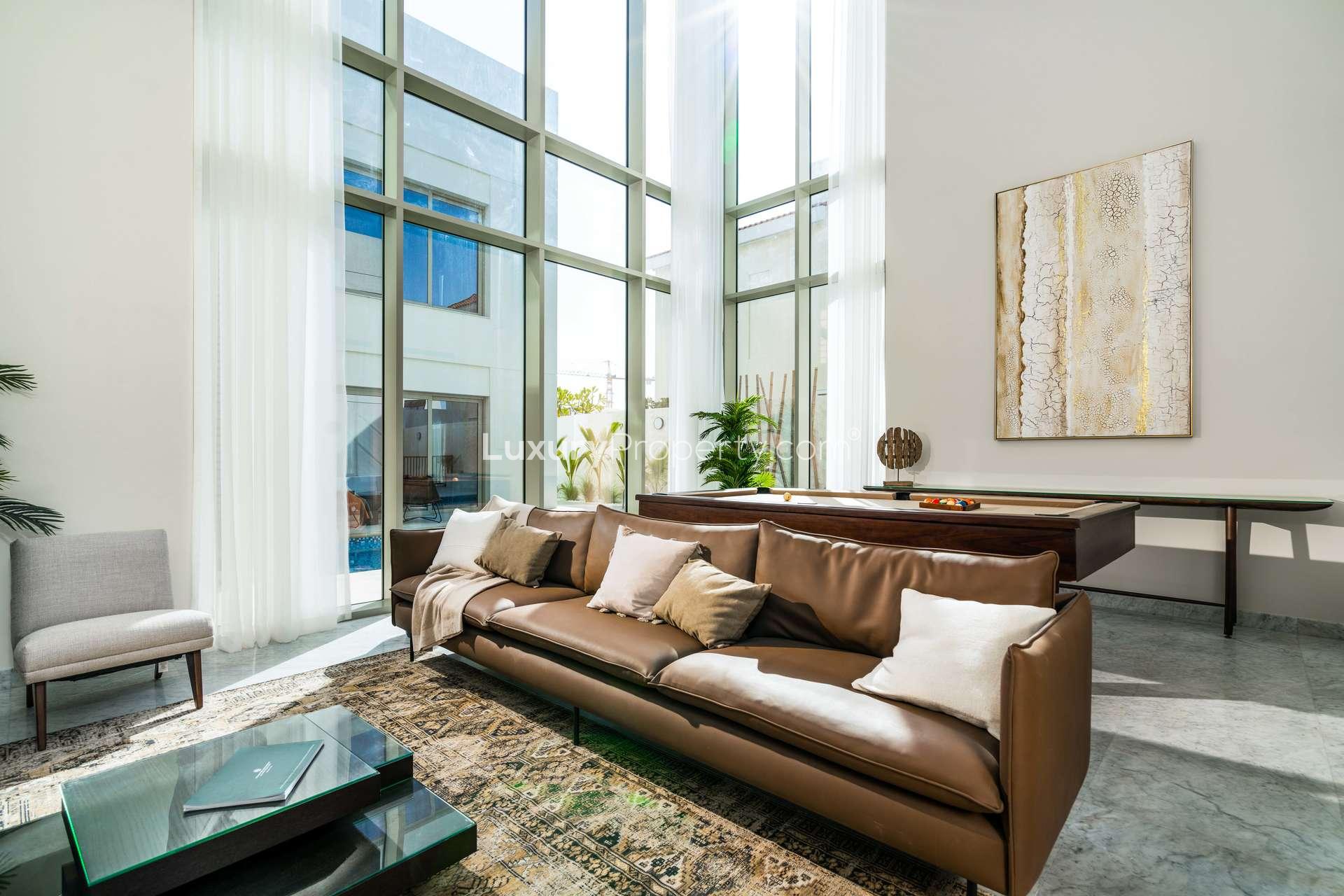 Luxury villa living room with pool view in District One, Dubai