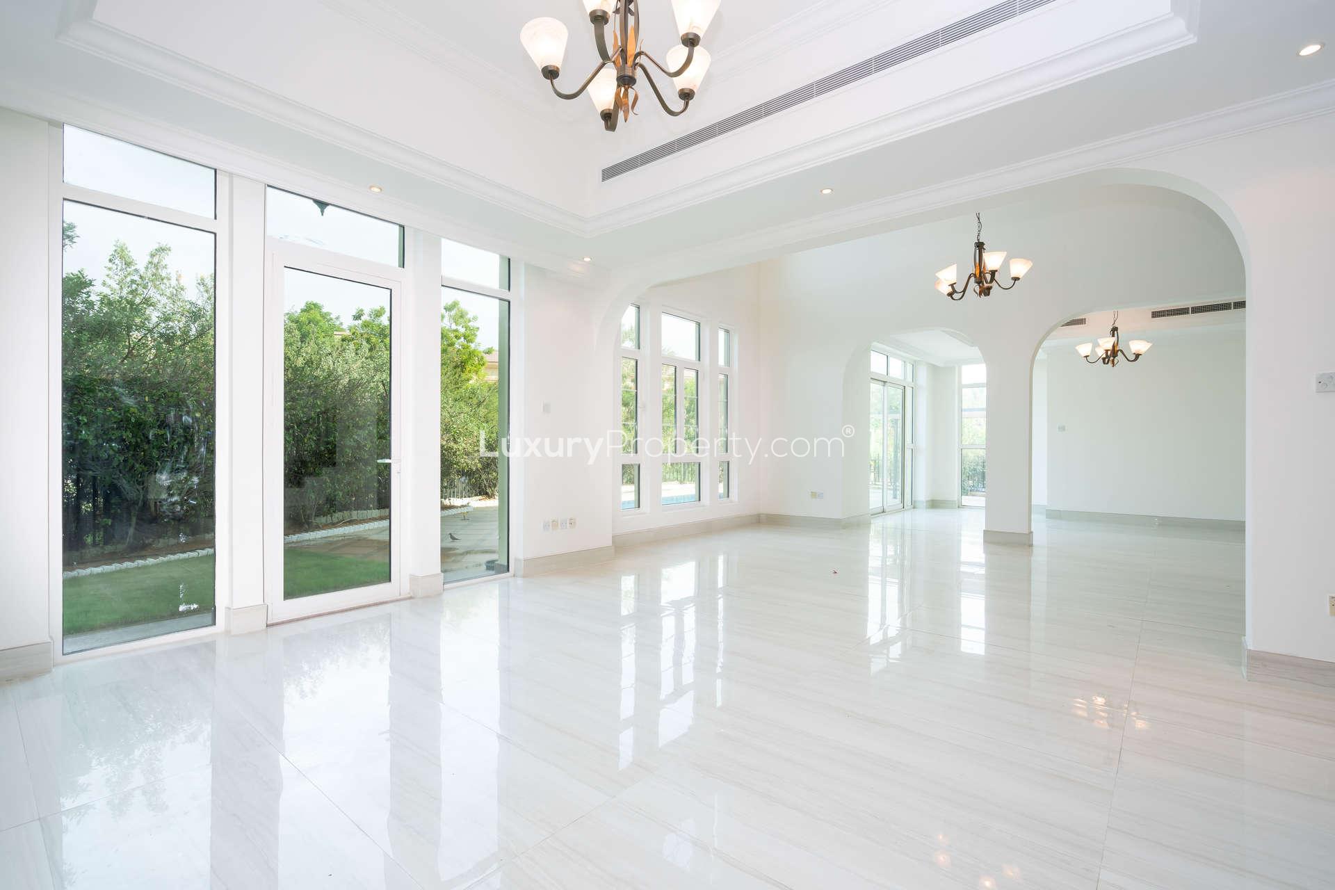Bright living room with large windows in Jumeirah Islands villa, Entertainment Foyer