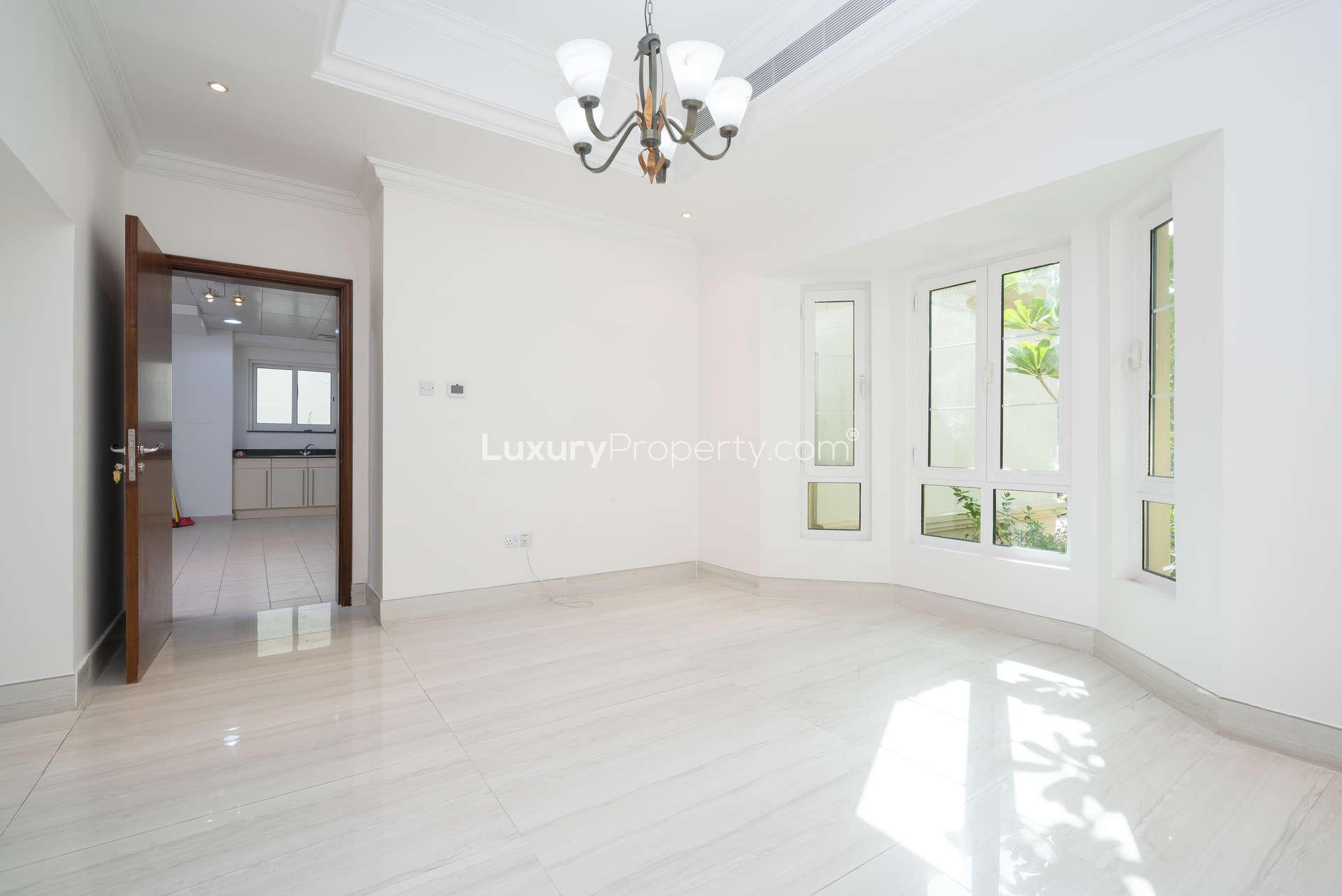 Spacious living area with garden views in Jumeirah Islands villa, Entertainment Foyer