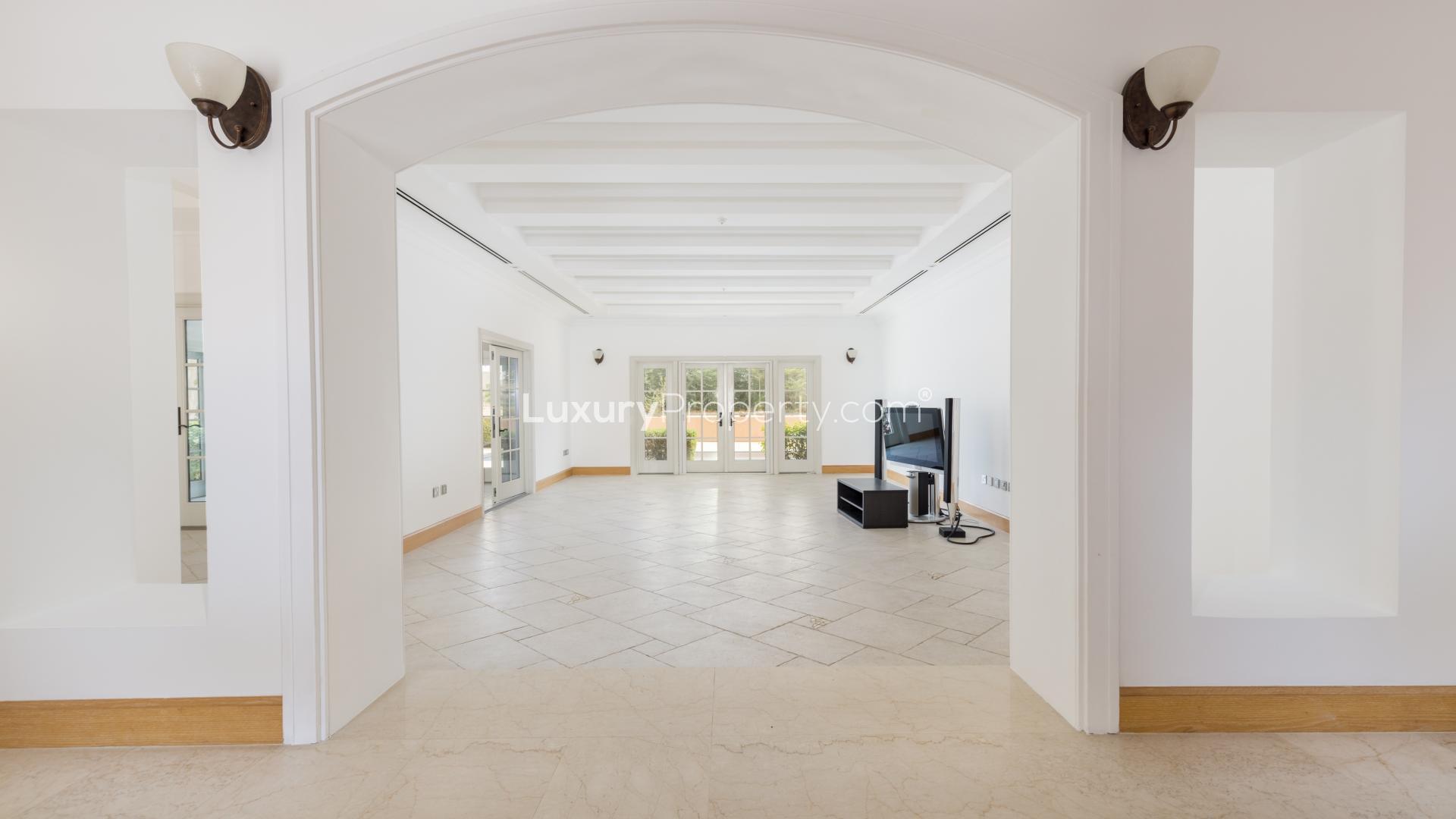 Front view of Inverness Villa in Jumeirah Golf Estates, Fire community, with lush greenery