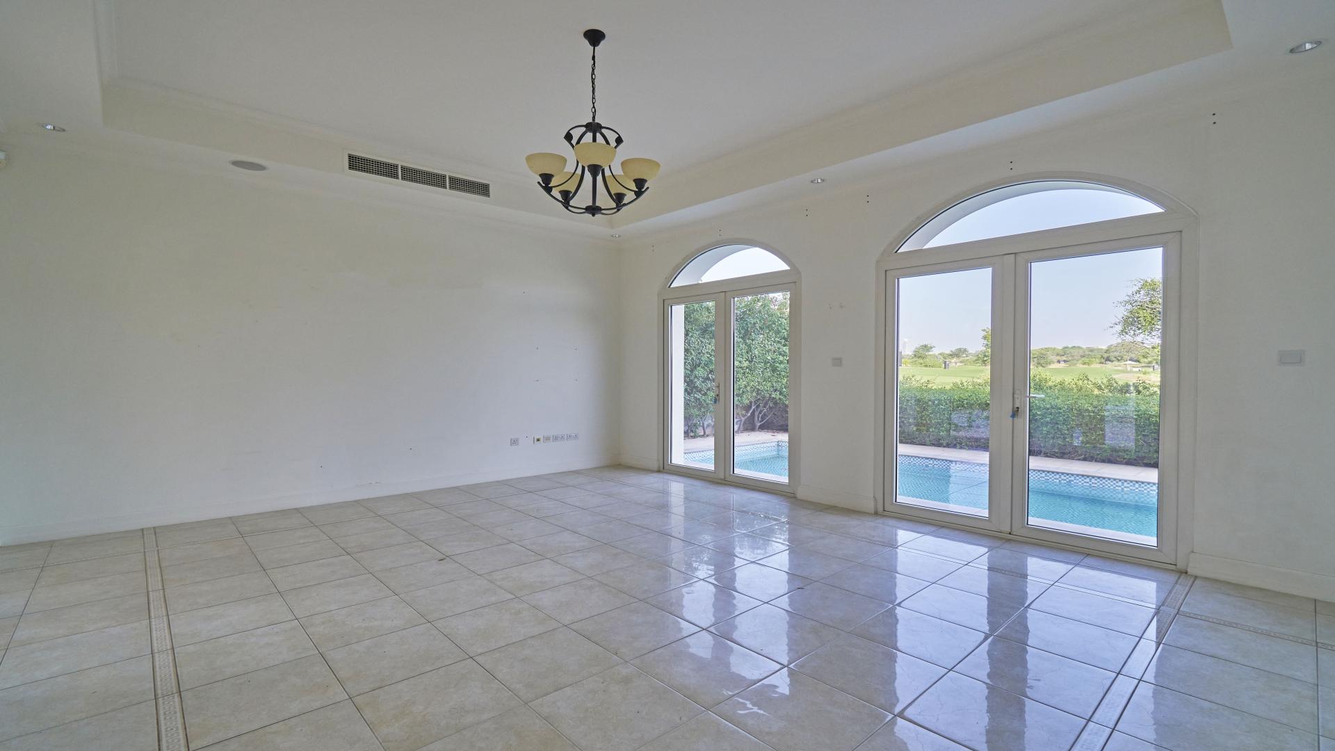 Elegant Sienna Lakes villa exterior in Jumeirah Golf Estates, Fire community, with driveway