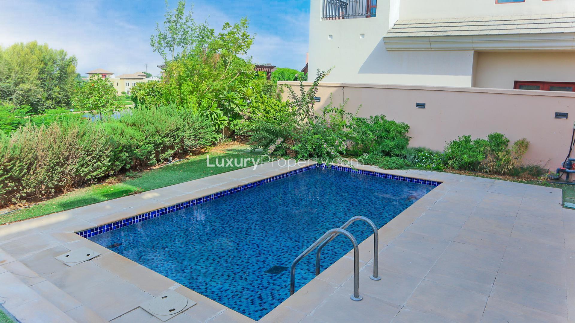 Lovely villa exterior with garage in Jumeirah Golf Estates, Fire community, for rent