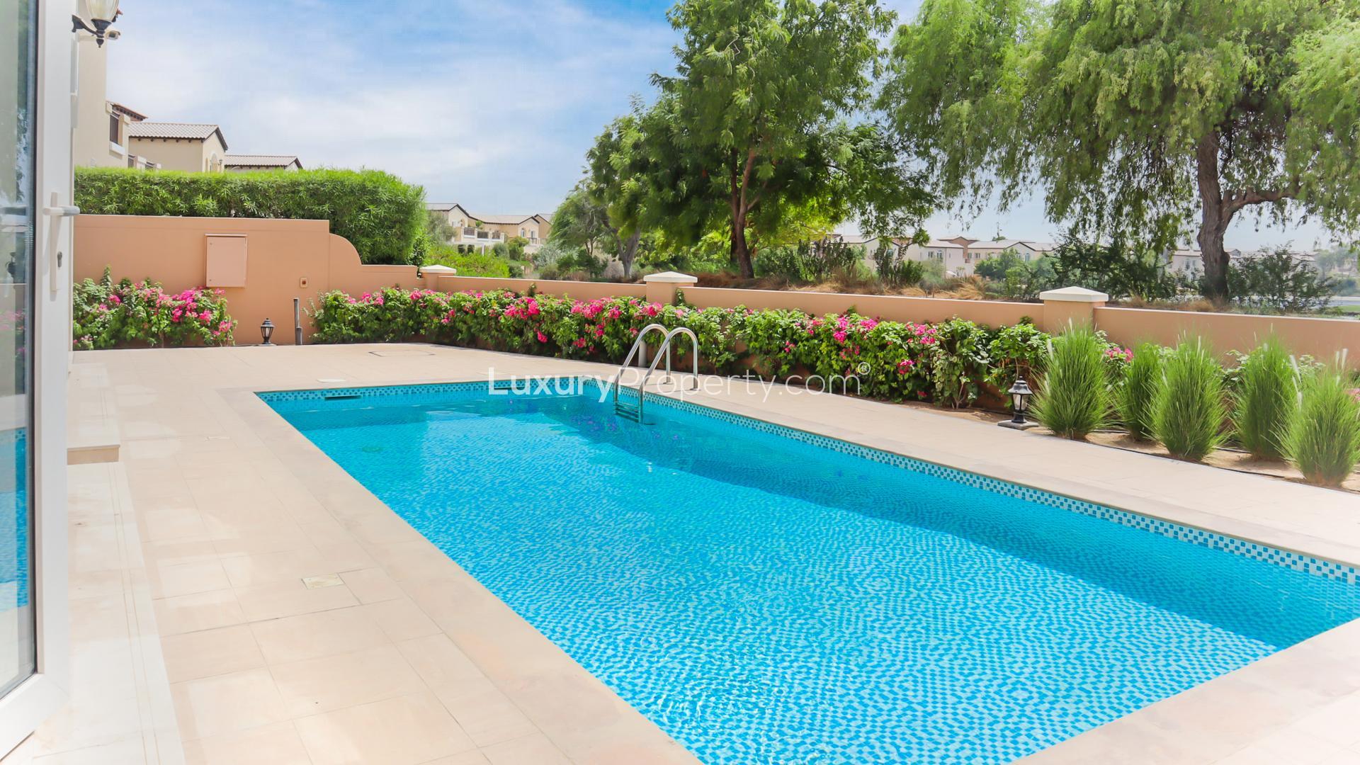 Luxurious villa pool with lush greenery in Jumeirah Golf Estates, Fire community