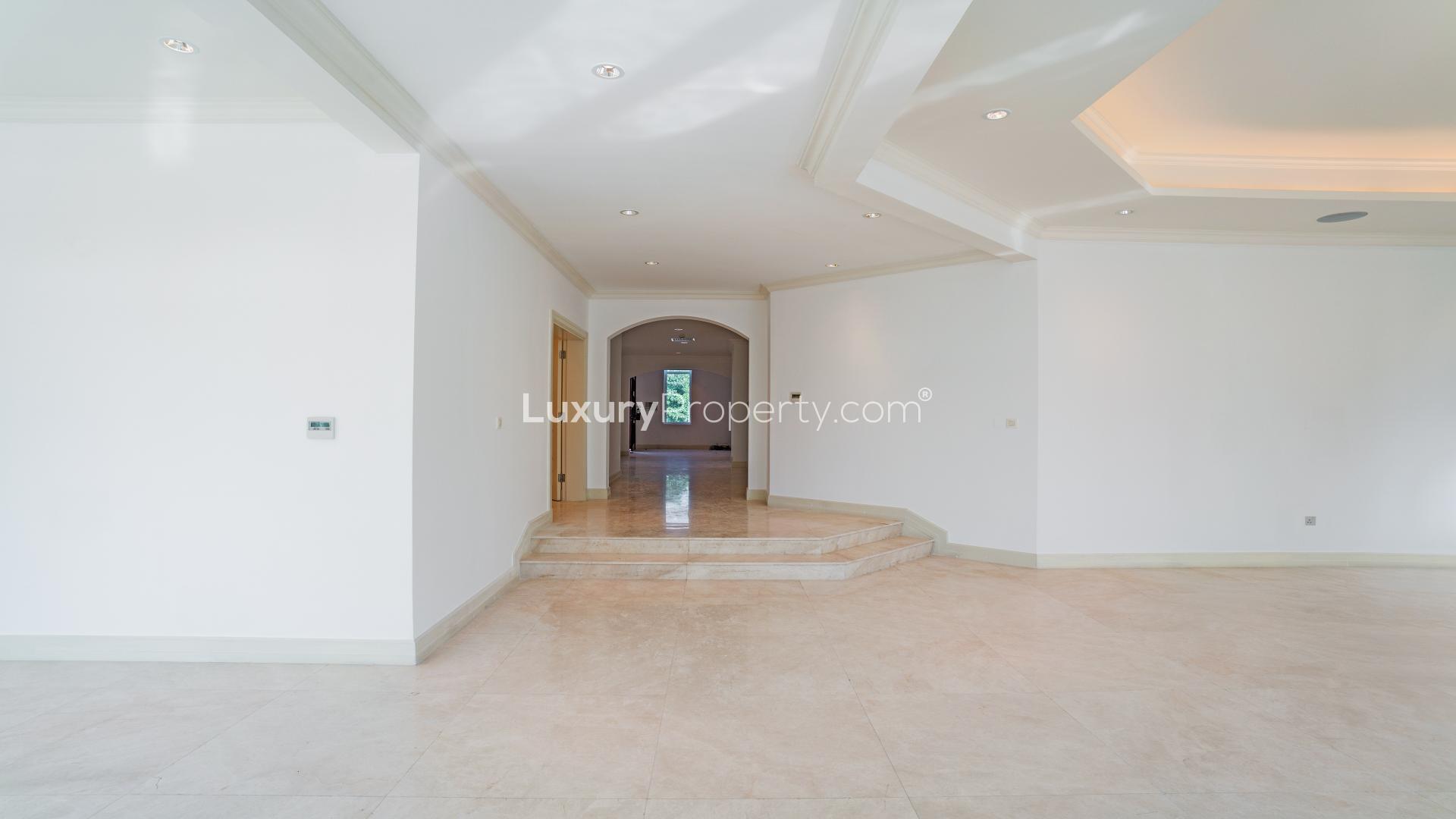 Upgraded villa interior with elegant marble flooring, Jumeirah Golf Estates, Fire community