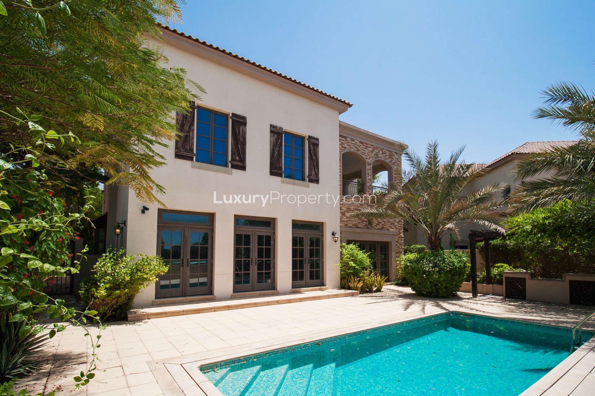 Luxurious bathroom in Flame Tree Ridge villa, Jumeirah Golf Estates, with elegant fixtures and tiles