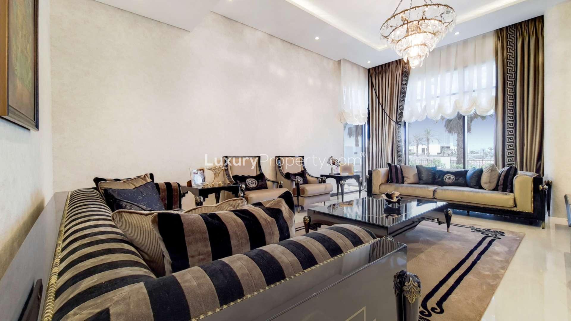 Modern villa exterior in Flora, Damac Hills with landscaped garden and covered parking area