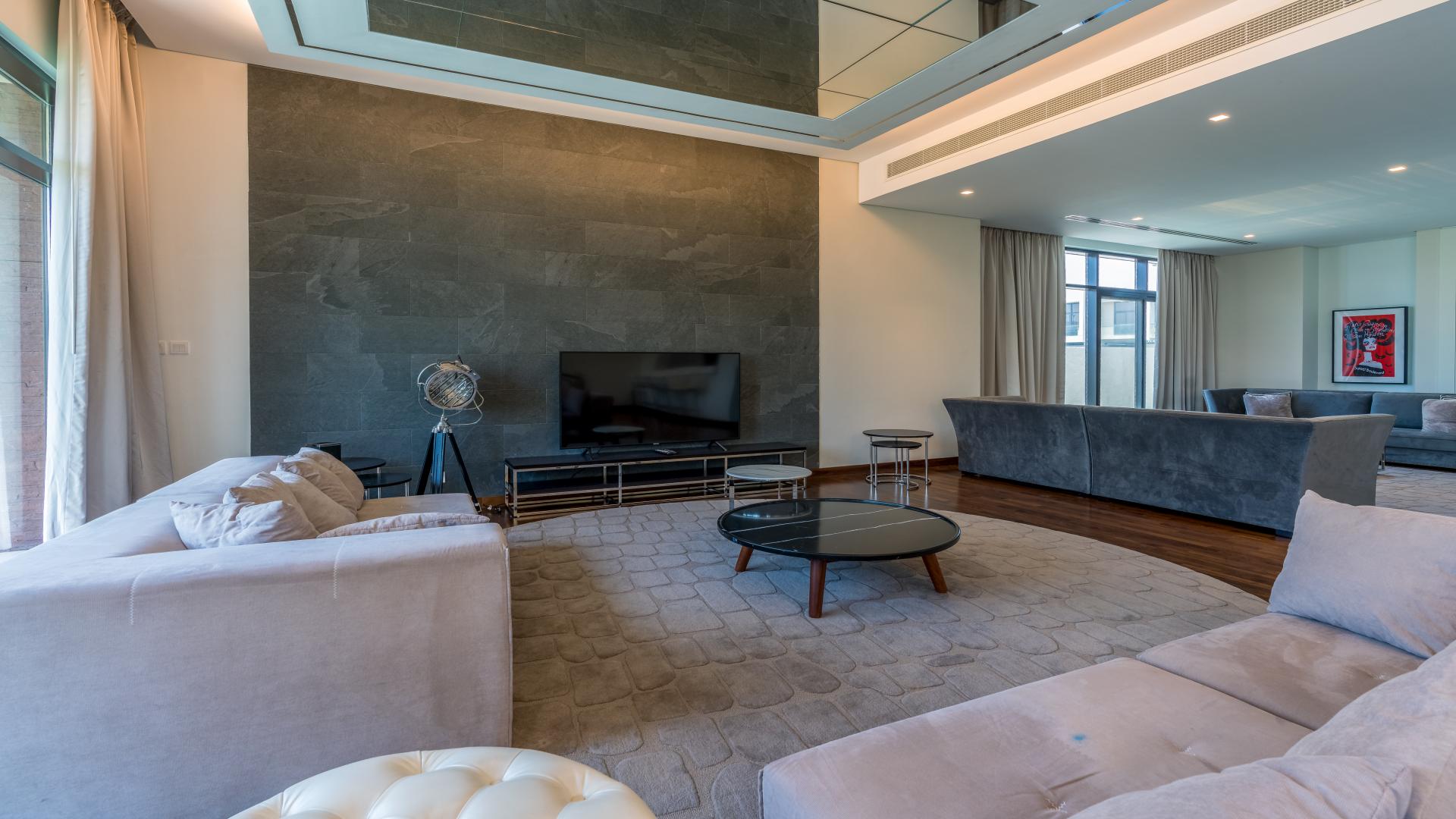 Luxurious living room in 5-bedroom villa, Flora, Damac Hills, with modern furnishings and decor