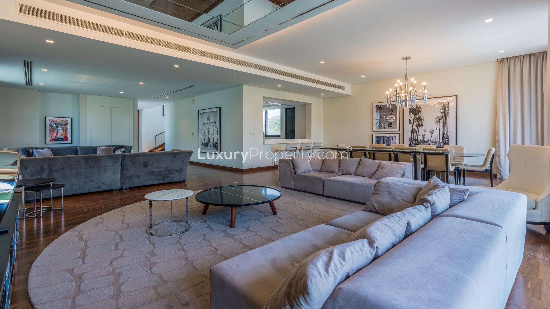 Luxury 5-bedroom villa exterior in Flora, Damac Hills for rent, spacious lawn view