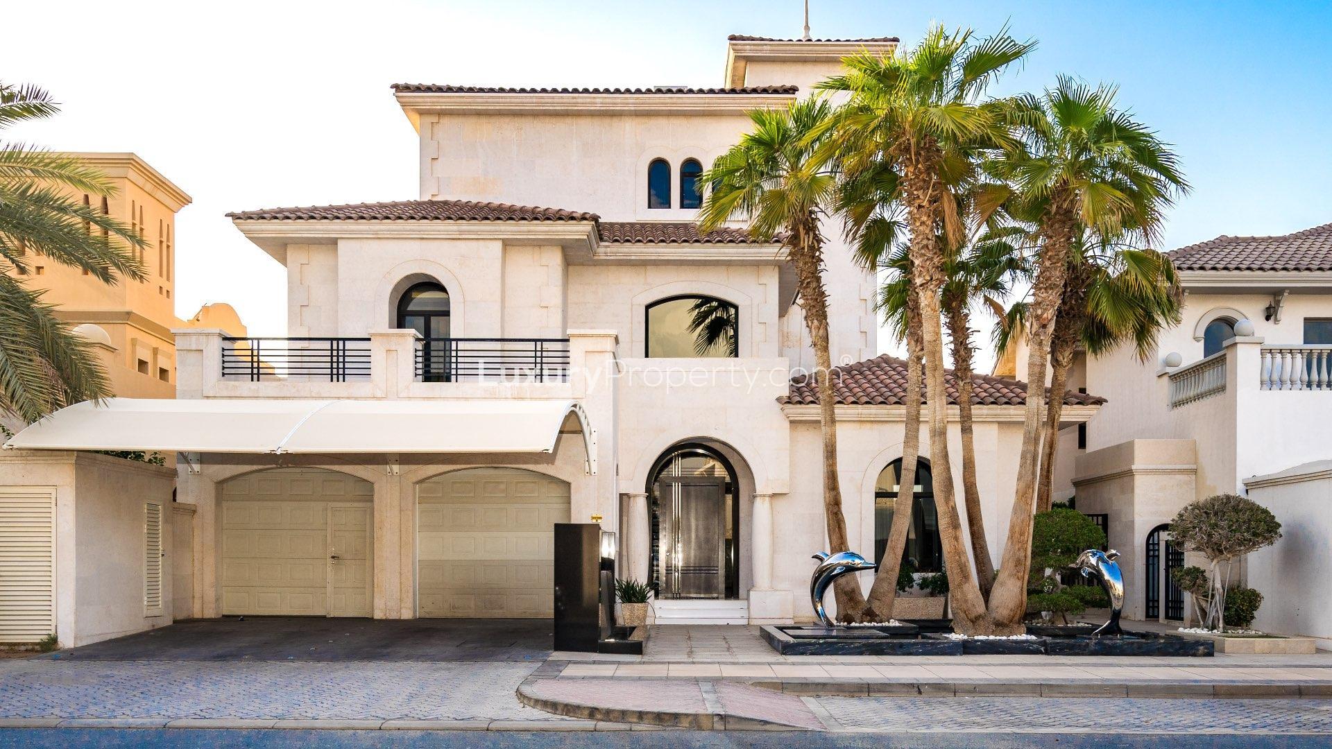 Fully upgraded 3-story Palm Jumeirah villa with pool, evening view, Garden Homes