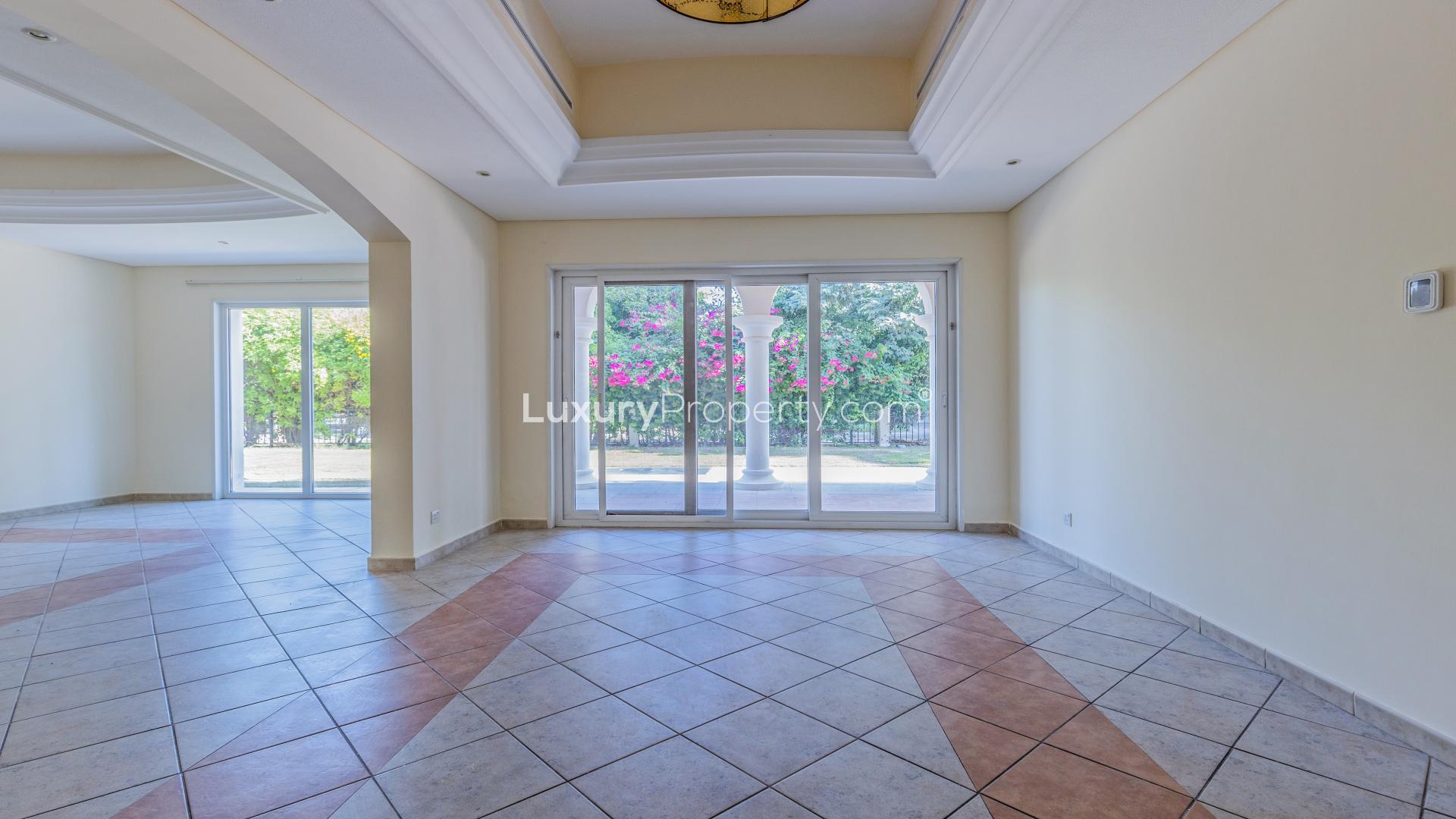 Spacious living area in 5-bedroom villa, Green Community West, with large windows and tiled floors