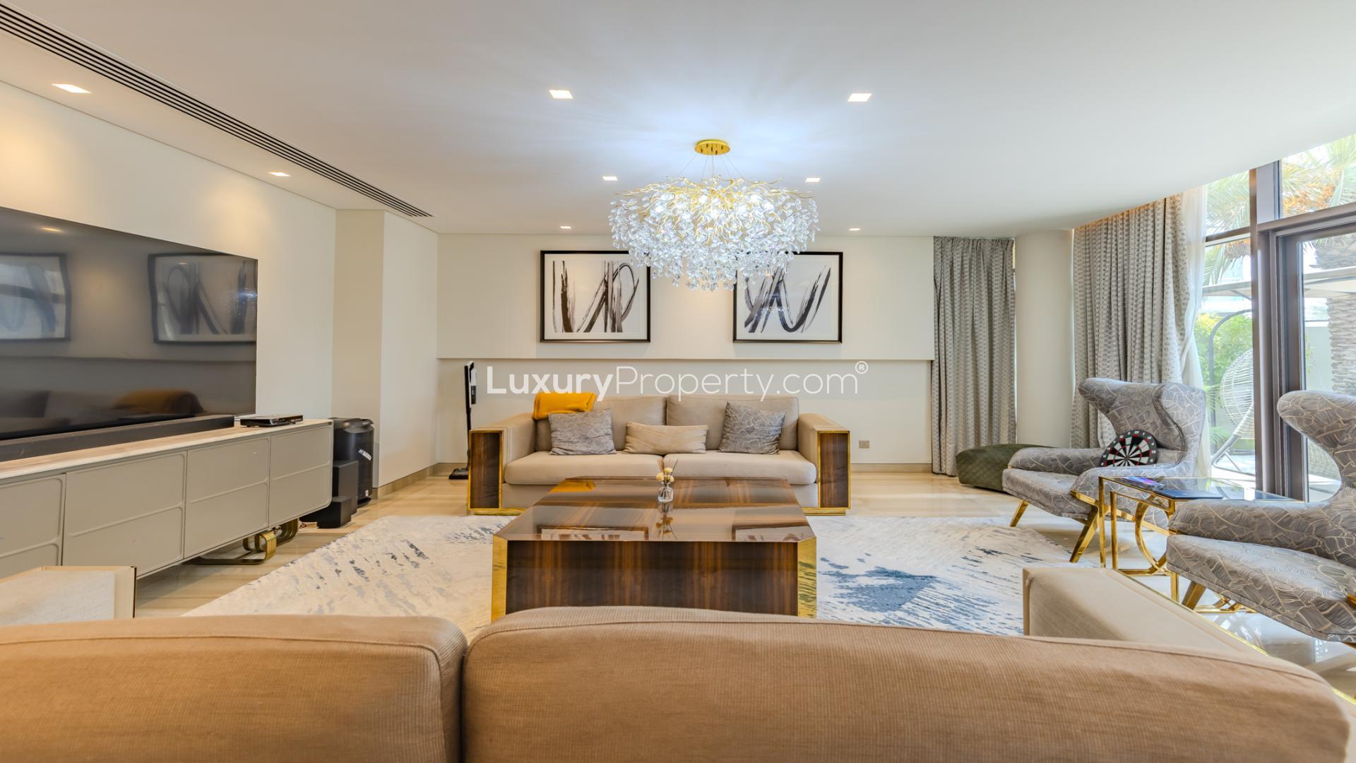 Luxury living room in furnished 5-bed villa, Trevi, Damac Hills, modern decor, elegant chandelier