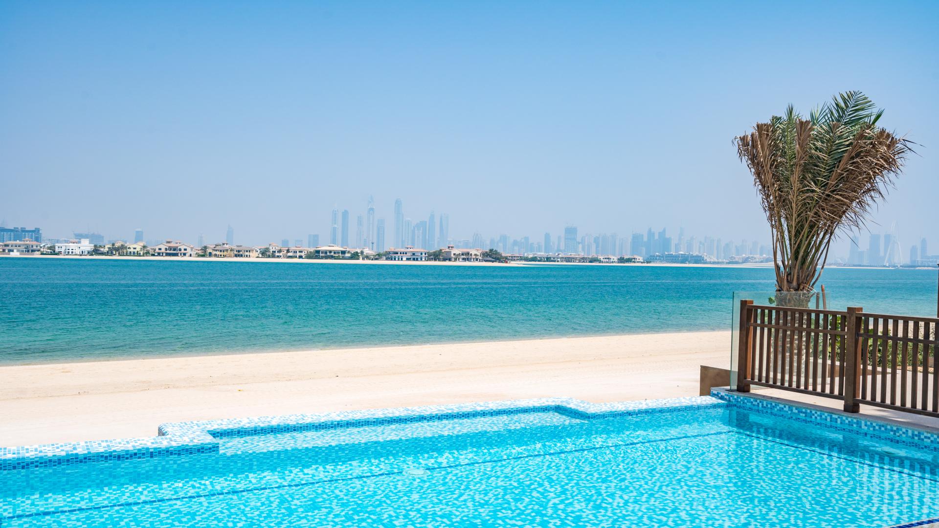 Spacious beachfront villa interior with ocean view, Palm Jumeirah, Kingdom of Sheba