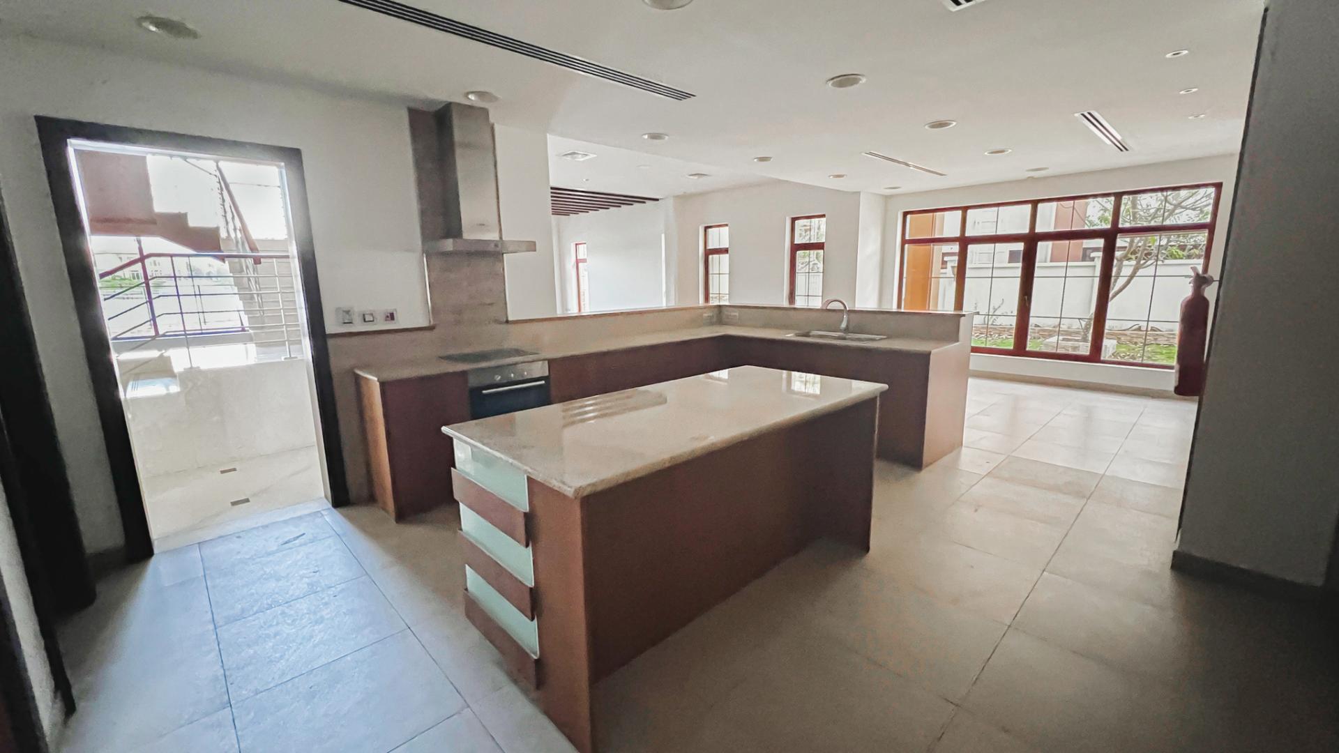 Spacious living room in 5-bedroom villa, The Mansions, Jumeirah Islands, marble flooring