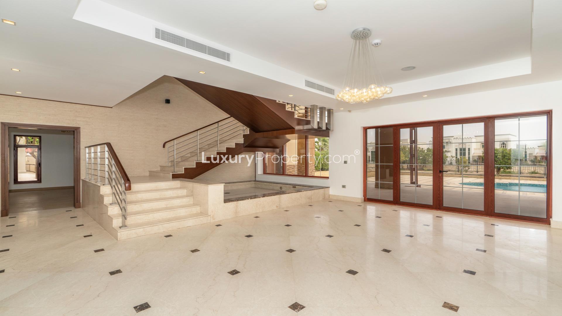 Spacious lounge with large windows in Jumeirah Islands mansion villa for rent